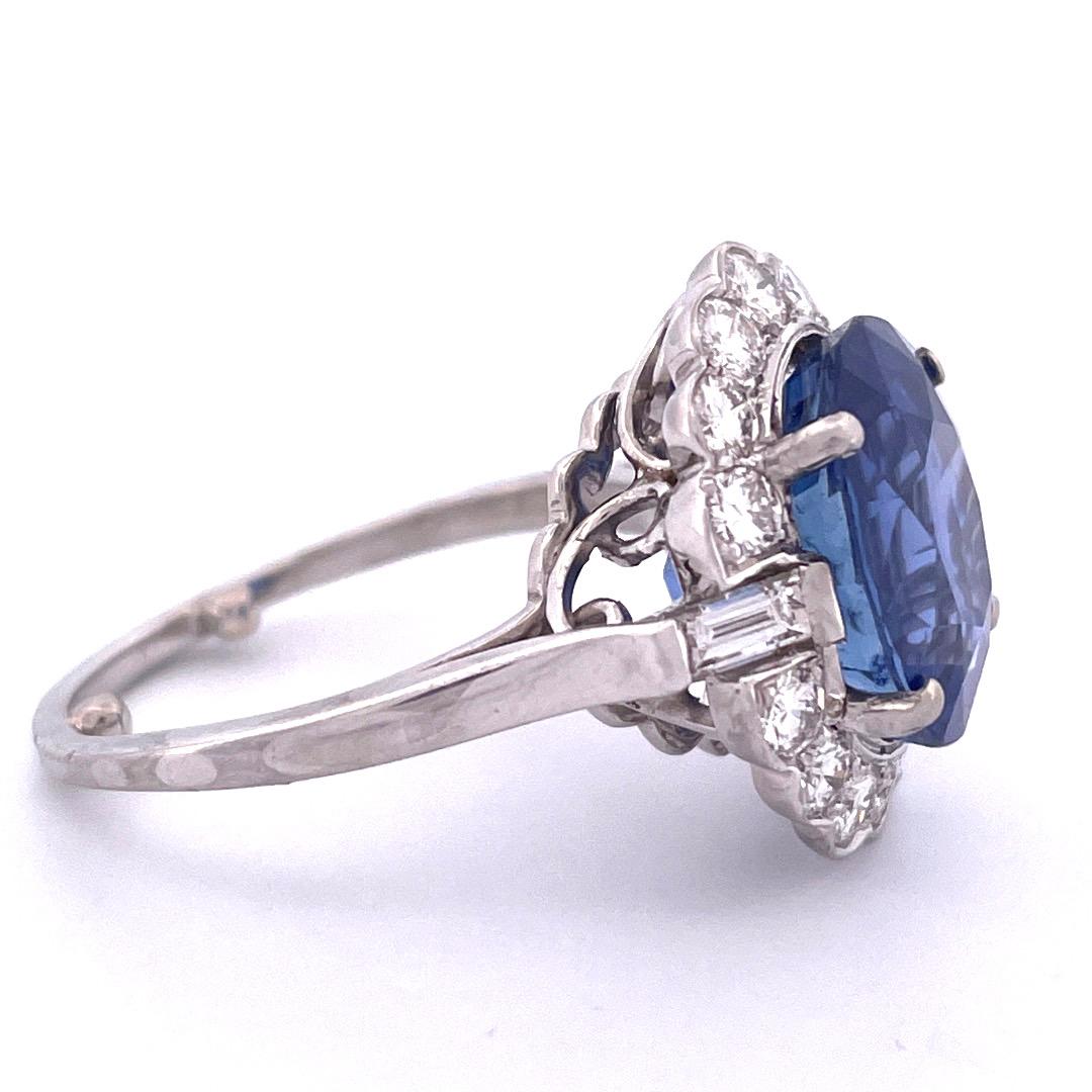 Elegant Platinum Sapphire and Diamond Ring

Embrace the allure of sophistication with this elegant platinum ring adorned with a captivating 9.72 carat oval-shaped sapphire at its center, beautifully complemented by a surrounding array of 2 total