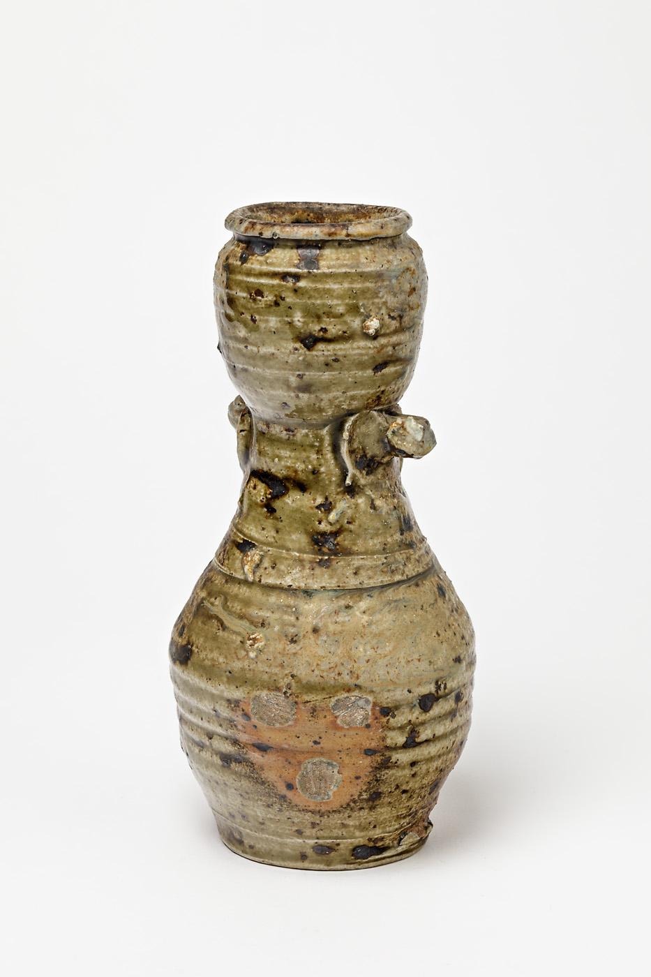 Steen Kepp

Elegant decorative ceramic vase.

Stoneware ceramic firing effects.

In the style of Japanese pottery.

circa 1970, realised in La Borne.

Dimensions: 22 x 11 x 11 cm.