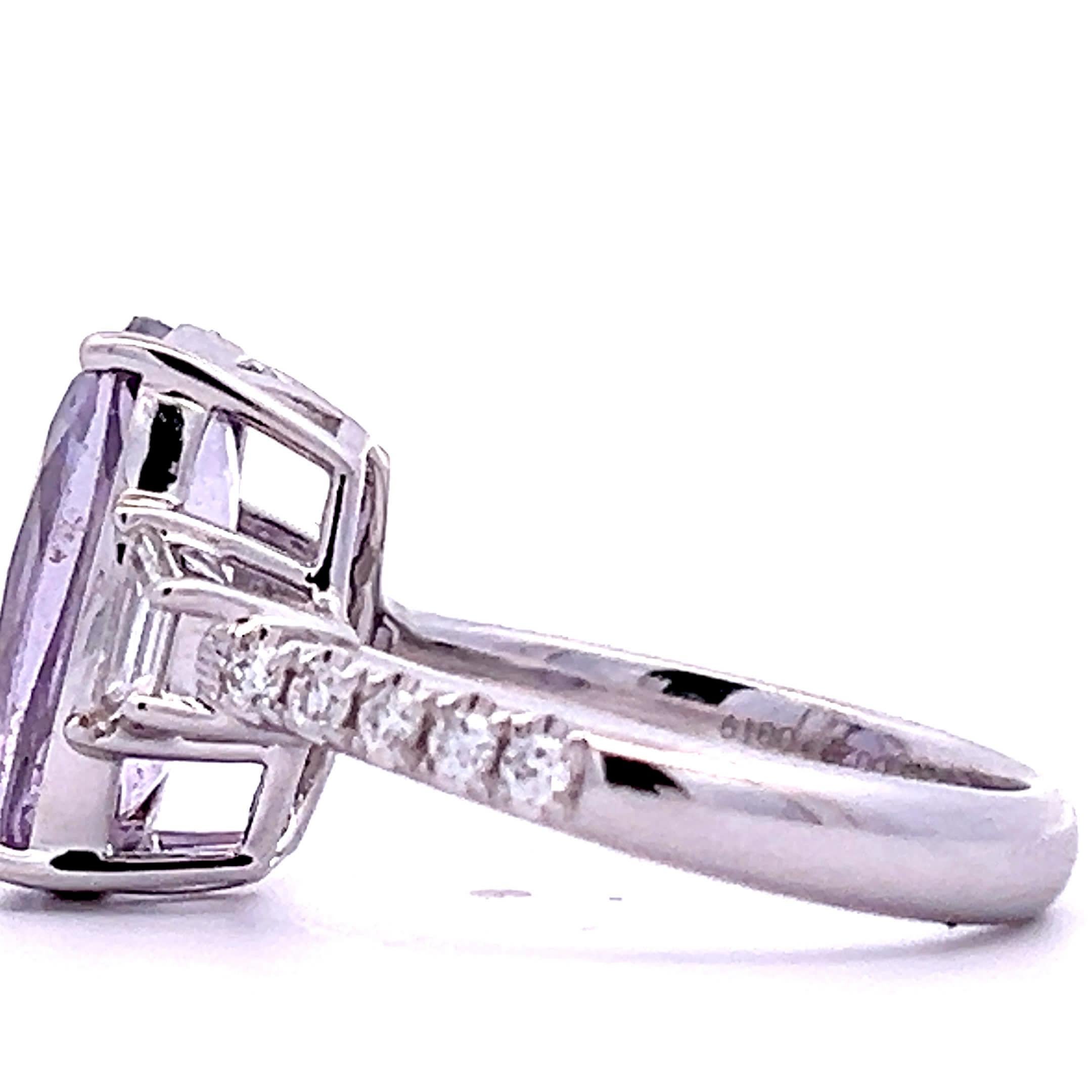 Discover the allure of this stunning purple gemstone ring, featuring a captivating oval-cut stone surrounded by sparkling accents. Crafted with precision, this piece is perfect for adding a touch of elegance to any outfit, whether for a special