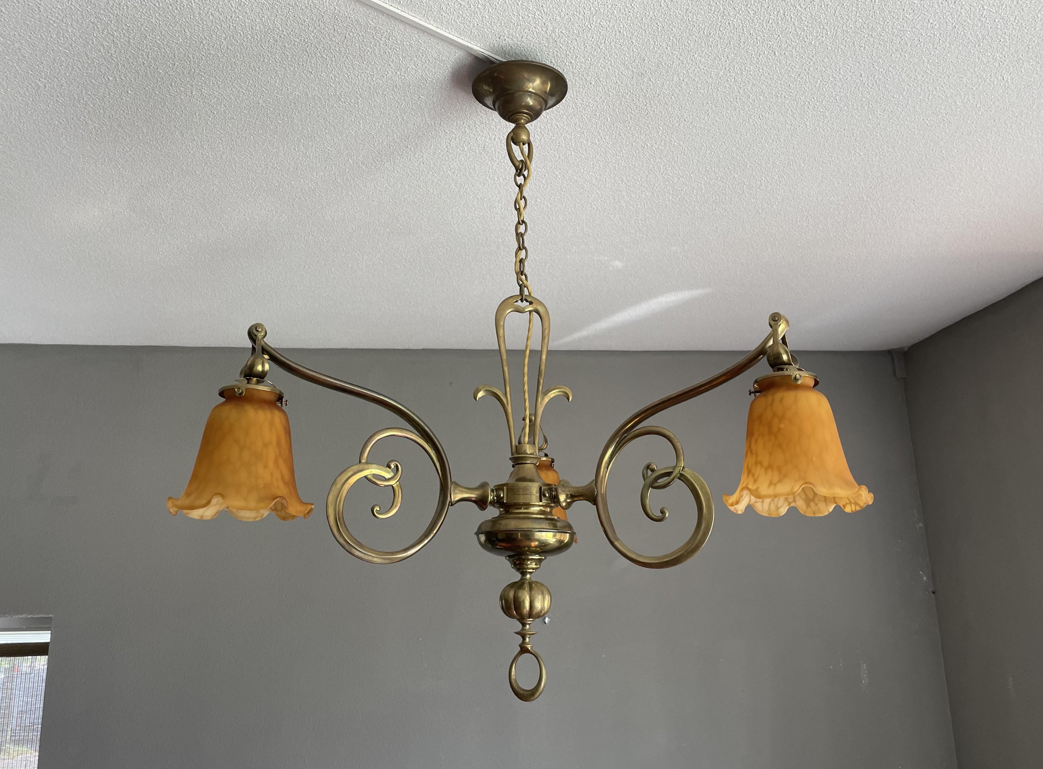 Magnificent chandelier with stunning patina and perfect art glass shades. 

This rare and extremely elegant Art Nouveau pendant dates from the earliest days of European, indoor lighting. This chandelier in a stunning Art Nouveau style is