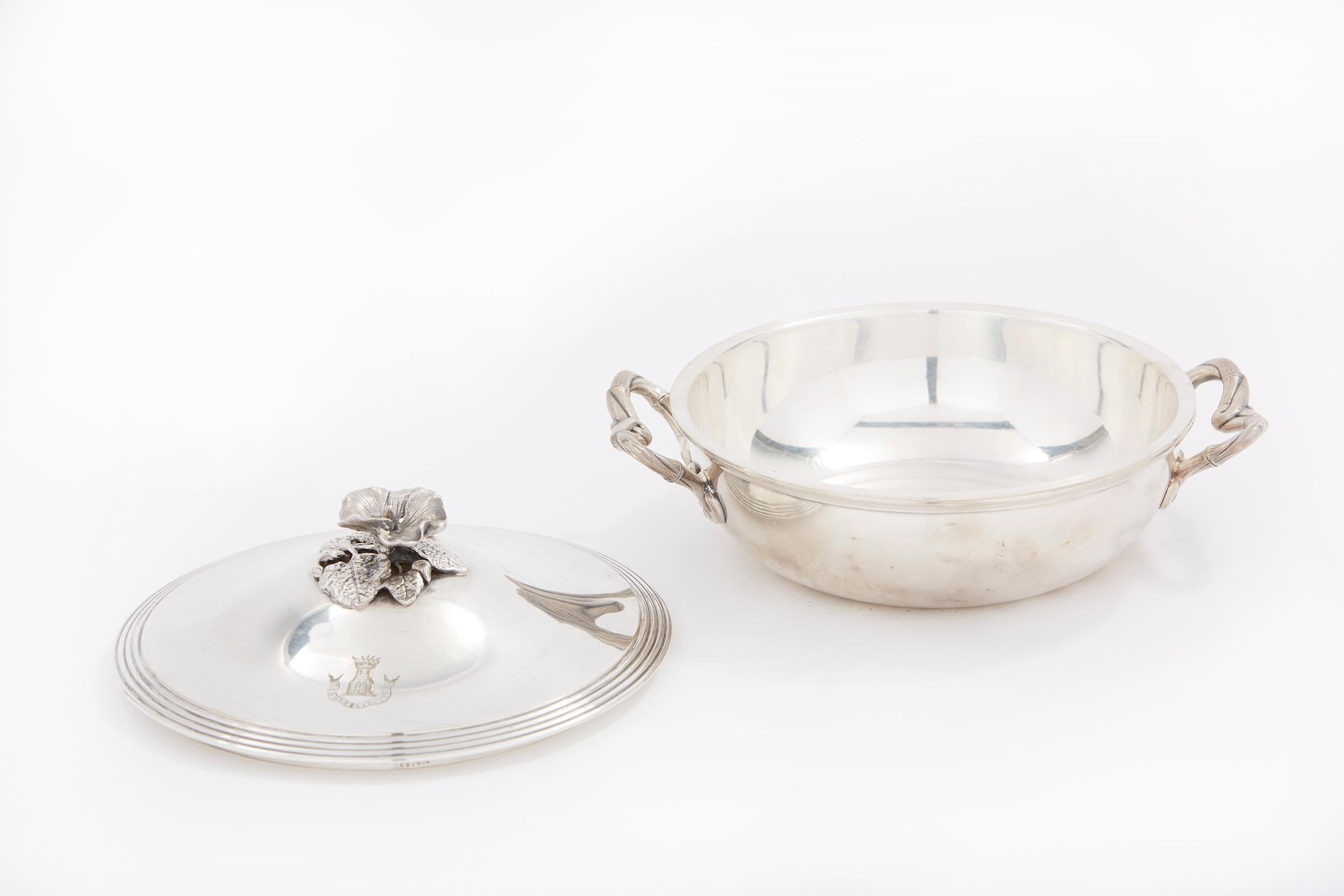 Elegant and refined French silver plated tableware covered dish / serving piece with side handles and exterior design details. The dish is in great condition. Minor wear consistent with age / use. Numbered & mark undersigned. The tureen stands about