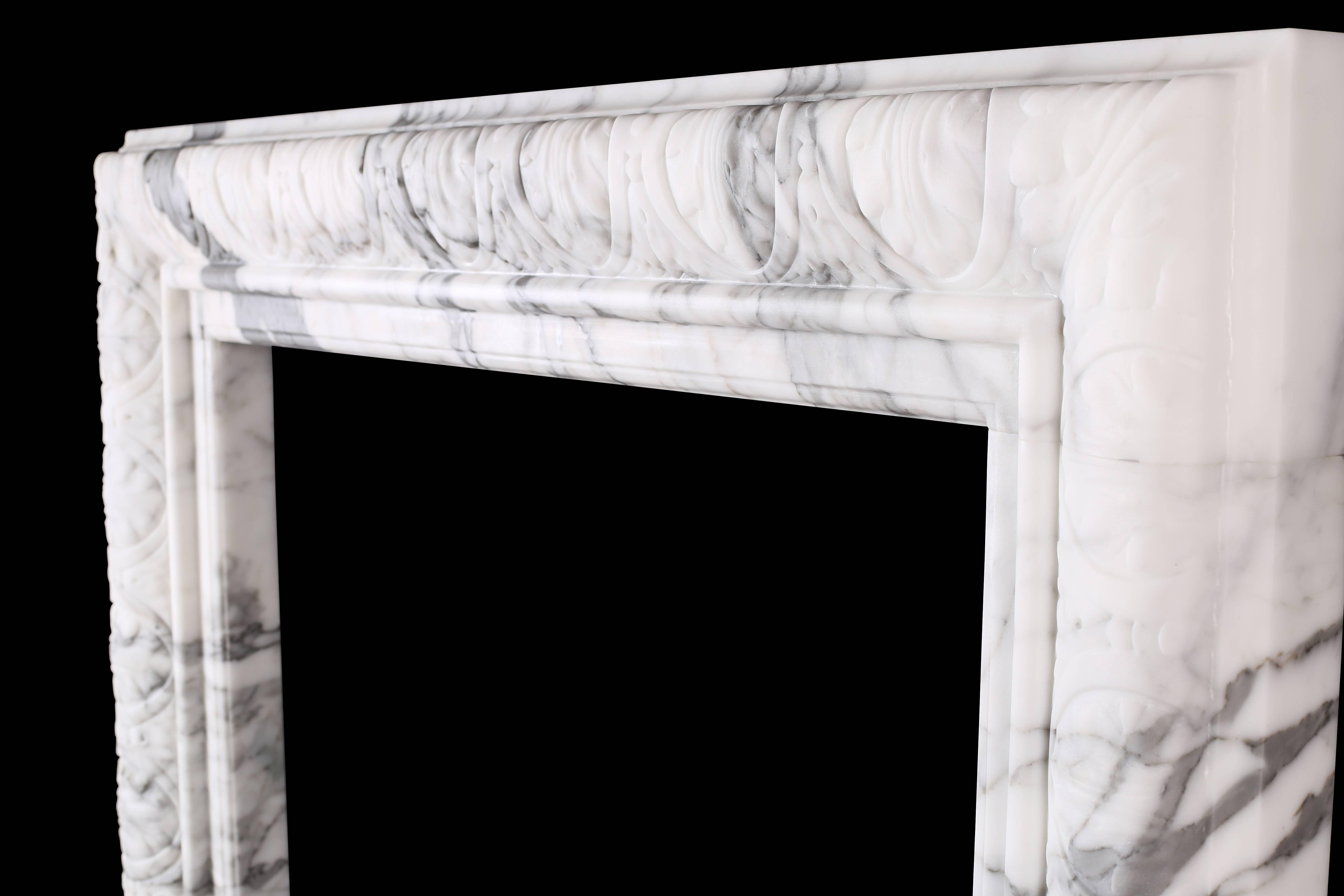 An elegant regency Baroque bolection fireplace in Italian white statuary marble.

Measures: Depth 4 1/2 in (115mm)
External height 45 3/4 in (1162mm)
External width 54 in (1370mm)
Internal height 38 in (965mm)
Internal width 38 1/4 in