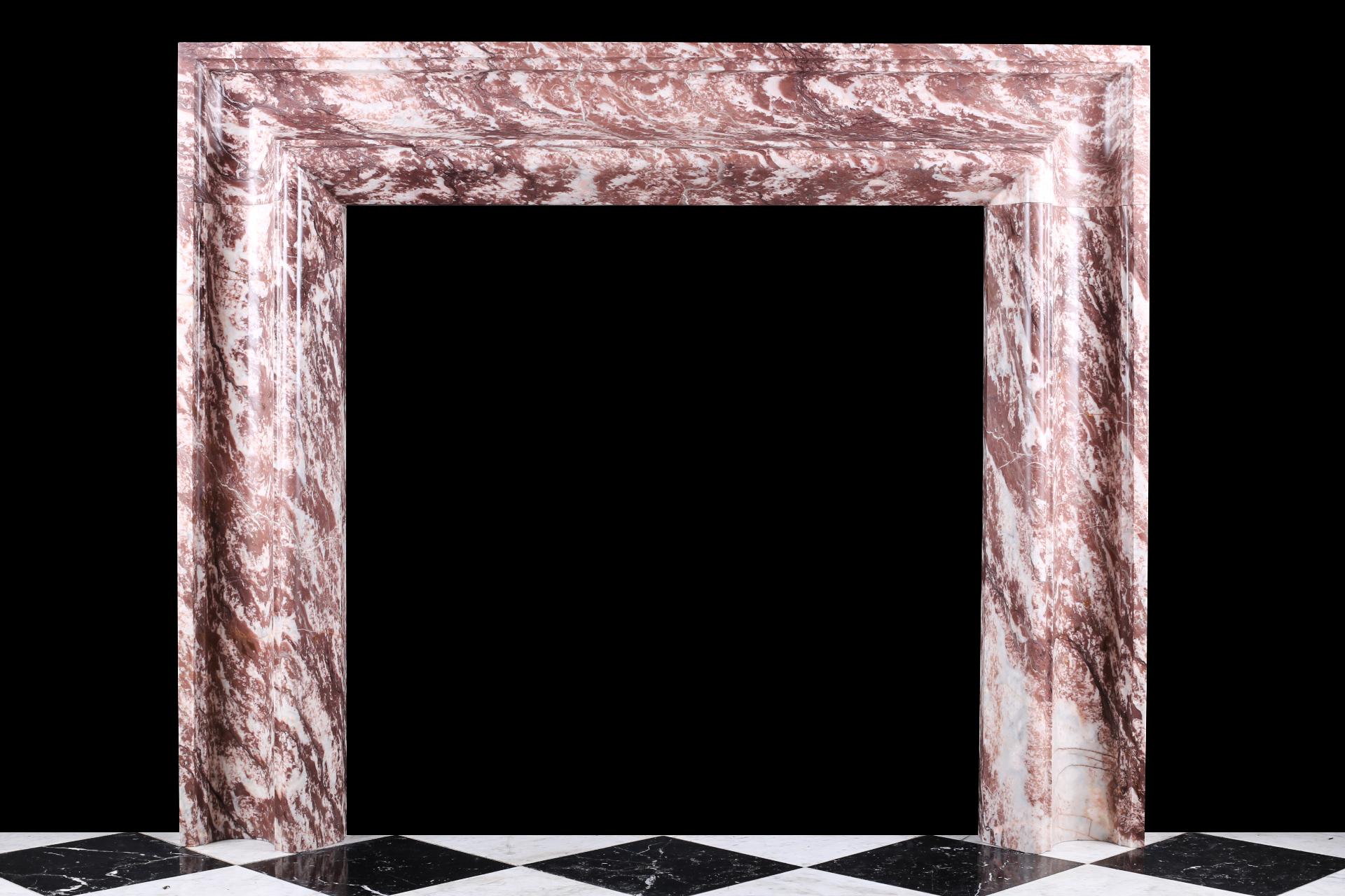 An elegant Regency baroque bolection fireplace mantle in Italian Fior di Pesco marble.

Depth 5