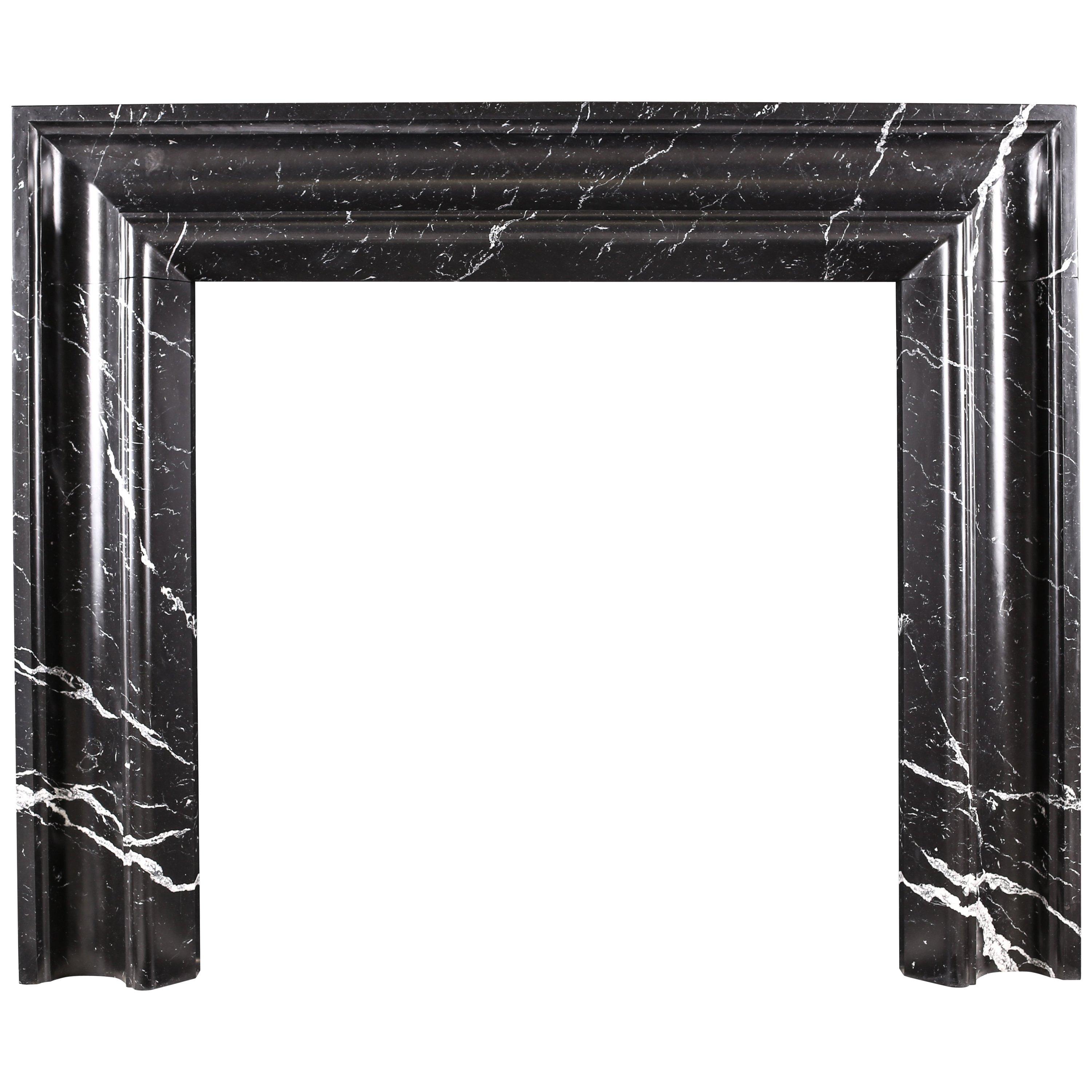 Elegant Regency Baroque Bolection Fireplace Surround in Italian Nero Marquina For Sale