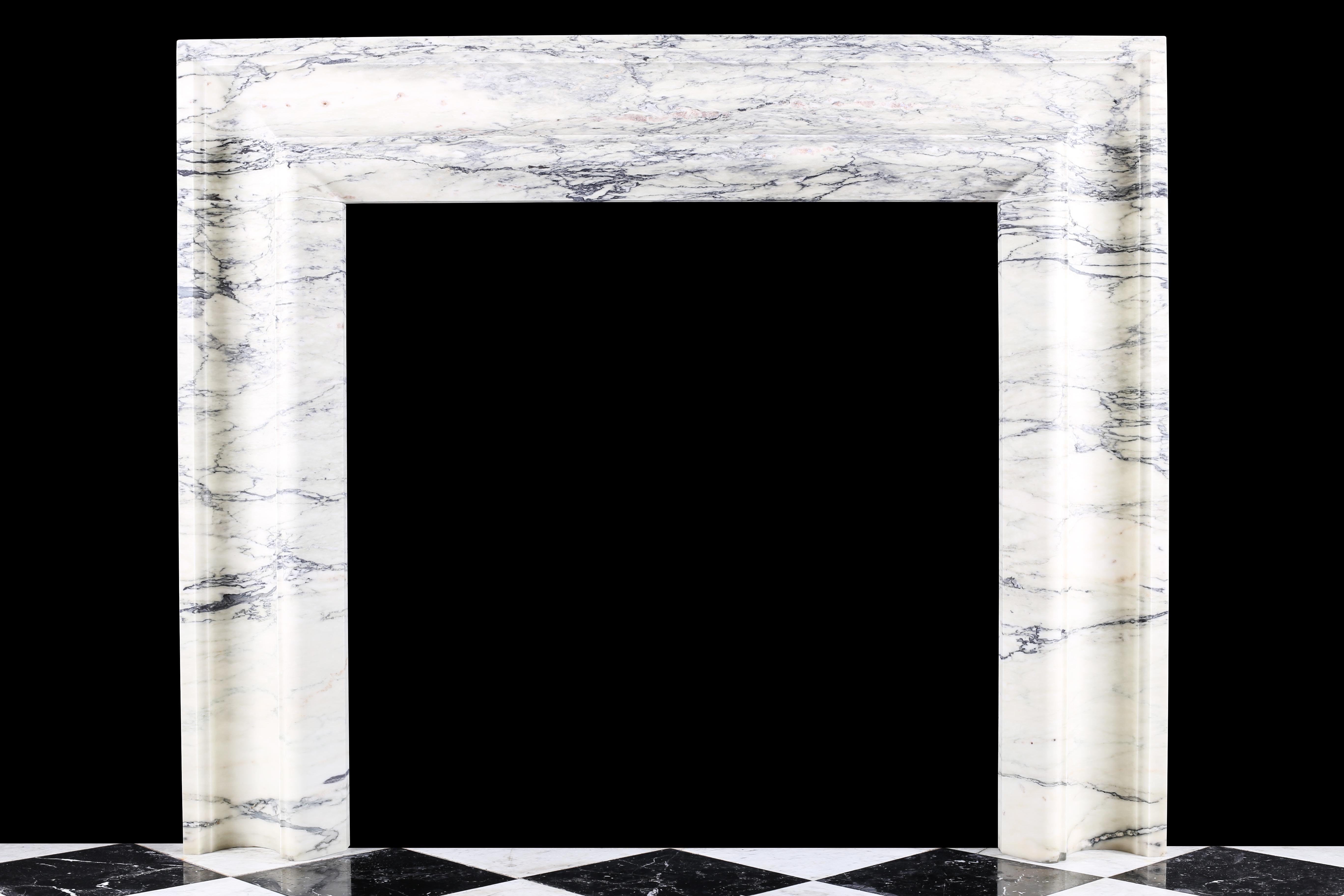 An elegant Regency Baroque Bolection fireplace surround in Italian Pavonazzo marble.

Measures: depth 5