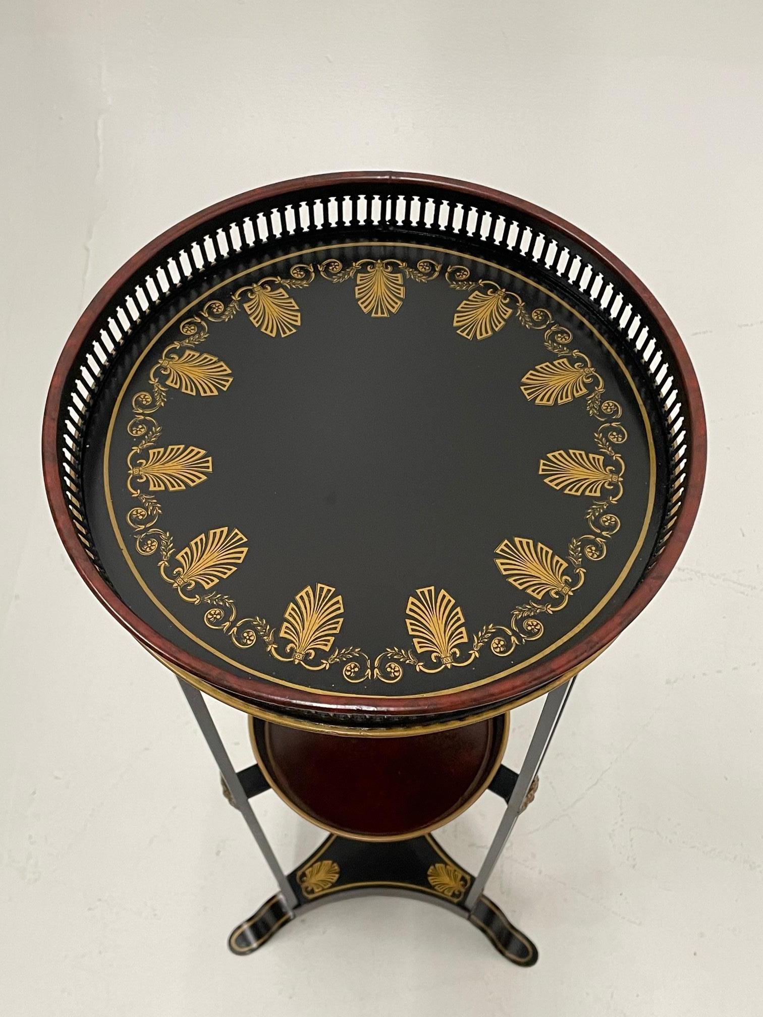 Regency style painted tole and iron 2 tier round side table having gilt decoration and metal galleries.
