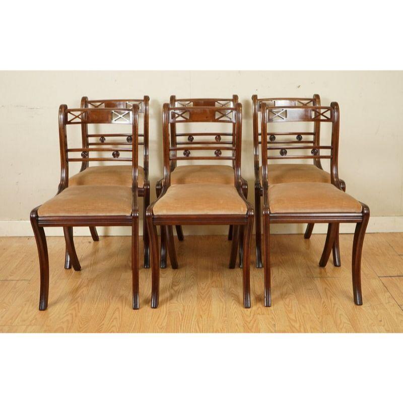 We are delighted to offer for sale this elegant Regency Style set of six dining chairs.

They are all in good condition and well looked after. The chairs have all sabre legs and a horizontal central splat with nicely carved crosses.

We have