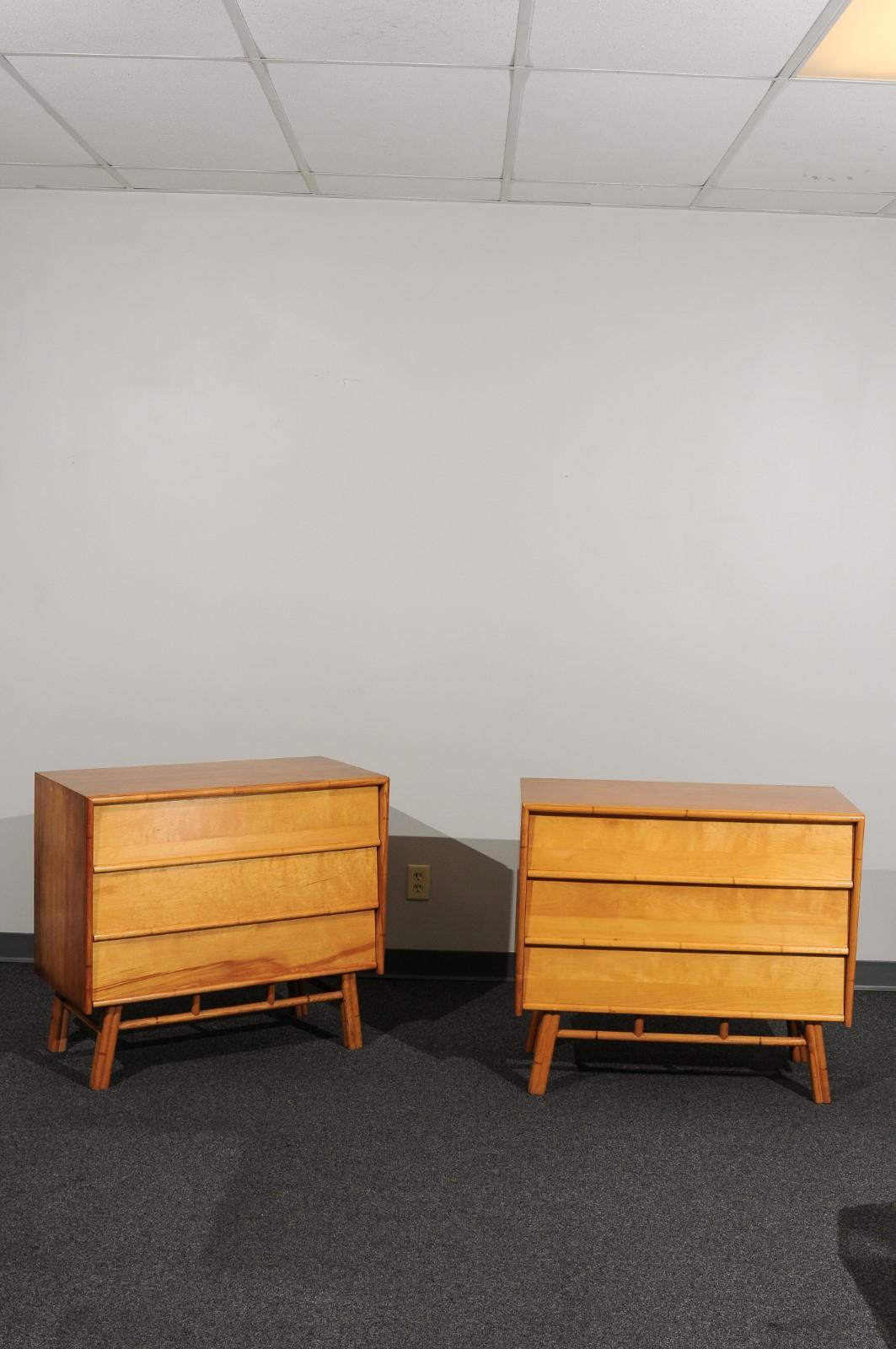 A stunning restored pair of modern chests by John Stuart, circa 1950. The sleek clean design is clearly influenced by the Florence Knoll case production of the same period. Expertly crafted solid maple plank construction. Exquisite Maple case