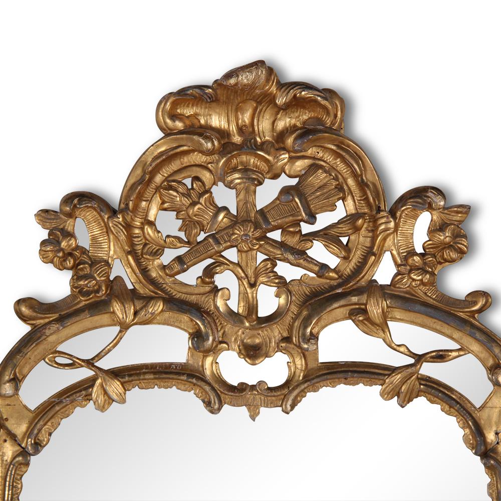 Beautiful gold giltwood rococo style mirror. Made of carved wood; no plaster or gesso on this quality piece.