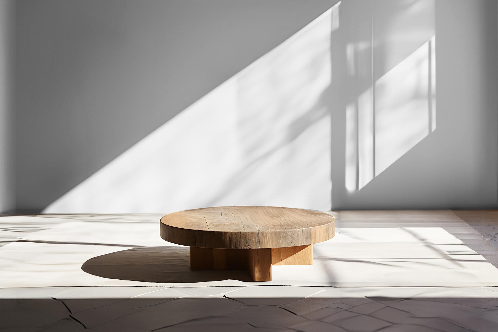 Elegant Round Coffee Table - Understated Design Fundamenta 44 by NONO

Sculptural coffee table made of solid wood with a natural water-based or black tinted finish. Due to the nature of the production process, each piece may vary in grain, texture,