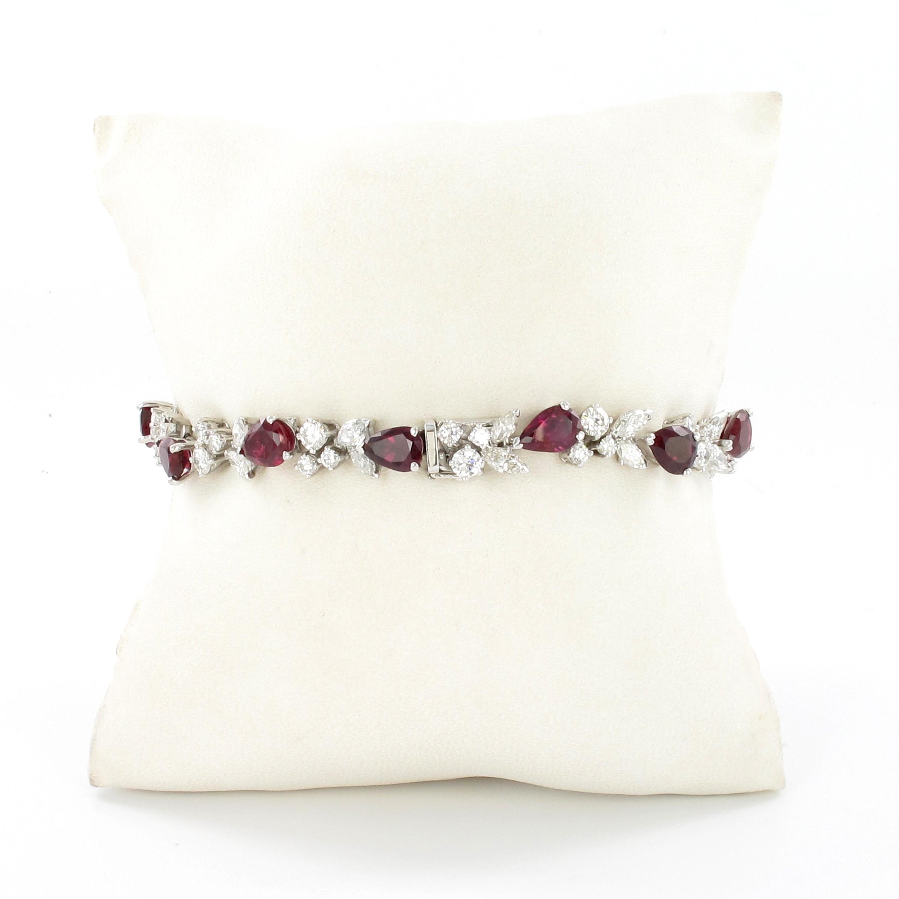 This beautiful and timeless bracelet by Swiss jeweller Gübelin is set with 12 pear-shaped rubies of intense colour, total weight approximately 9.50 carats. The rubies are set alternately to the right and left, similar to an ear of corn. In between,