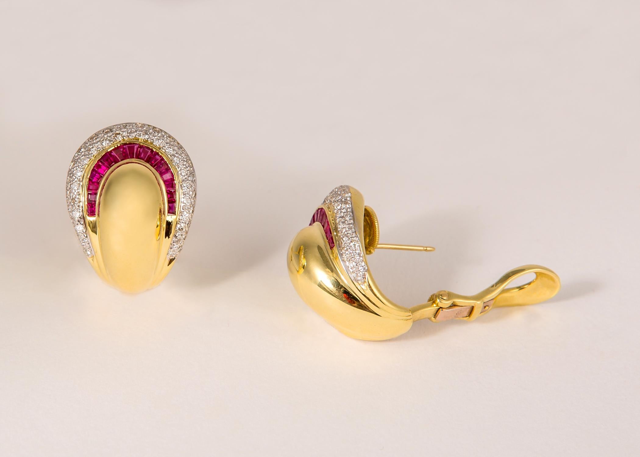 A simple elegant shape created in rich 18k gold and accented with brilliant cut diamonds and baguette cut rubies. This contemporary classic earring can be worn day to night. 1  1/16 of an inch.
