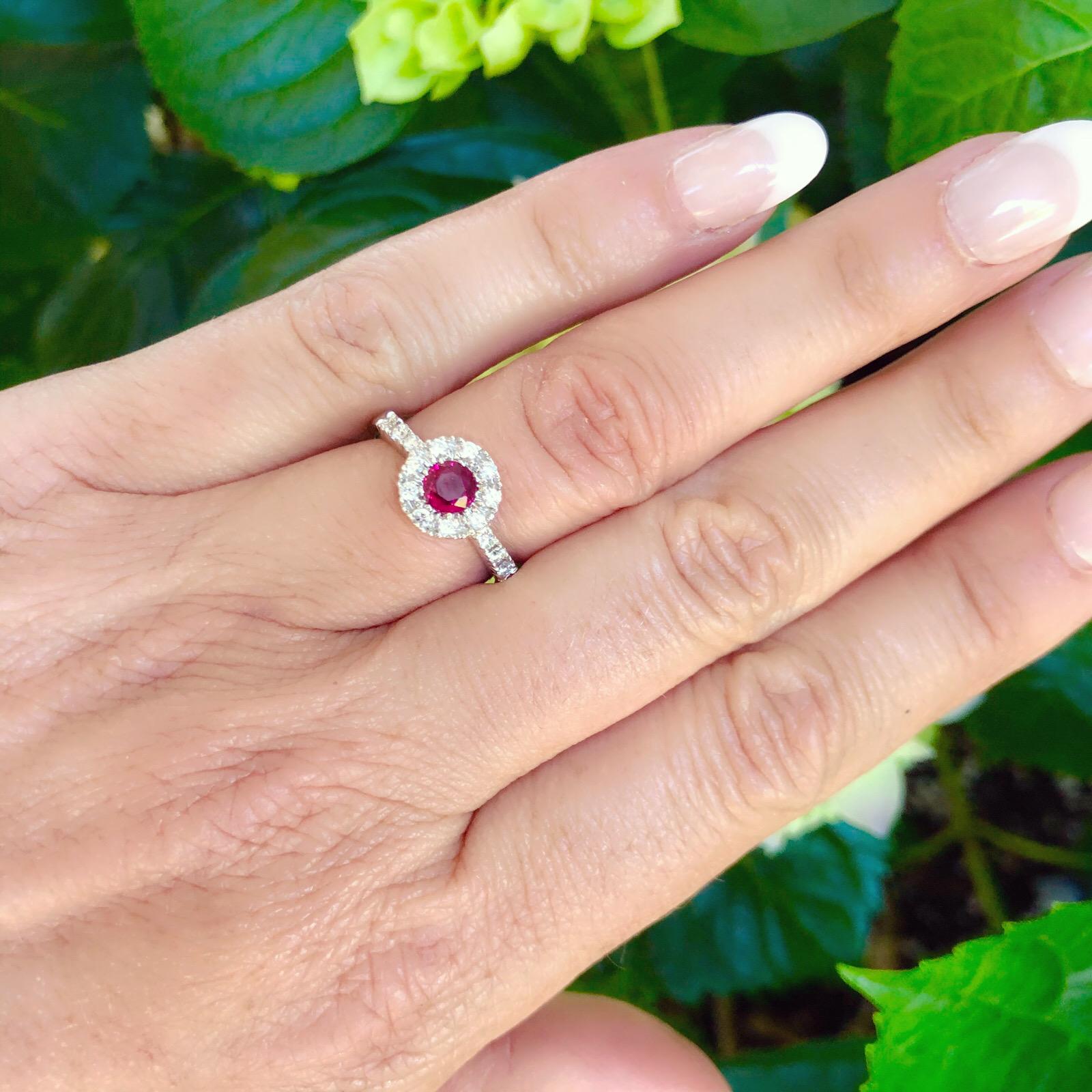 Gorgeous ring by Favero features one 0.49ct Round Brilliant Cut Ruby set with 16 Round cut Diamonds with a total approximate weight of 0.31cts in an 18Kt White Gold setting. The weight of the ring is 4.9 grams and is a size 6.75. The perfect accent