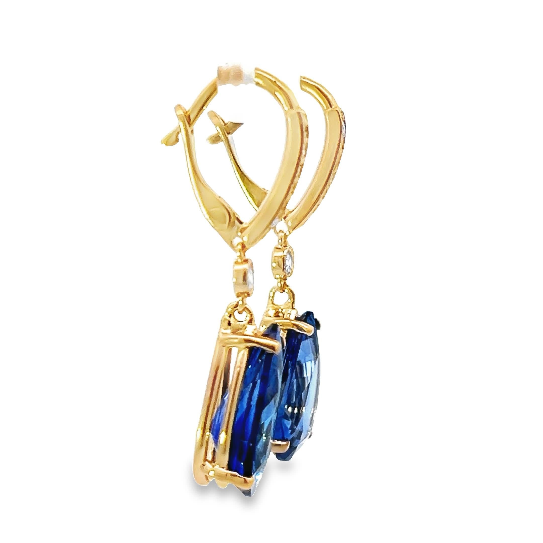 Drape your ears in the luxurious shimmer of these sapphire drop earrings. Crafted with a stunning blue hue, each earring boasts a pear-shaped sapphire encased in an elegant gold setting, accented by sparkling diamonds that catch the light at every