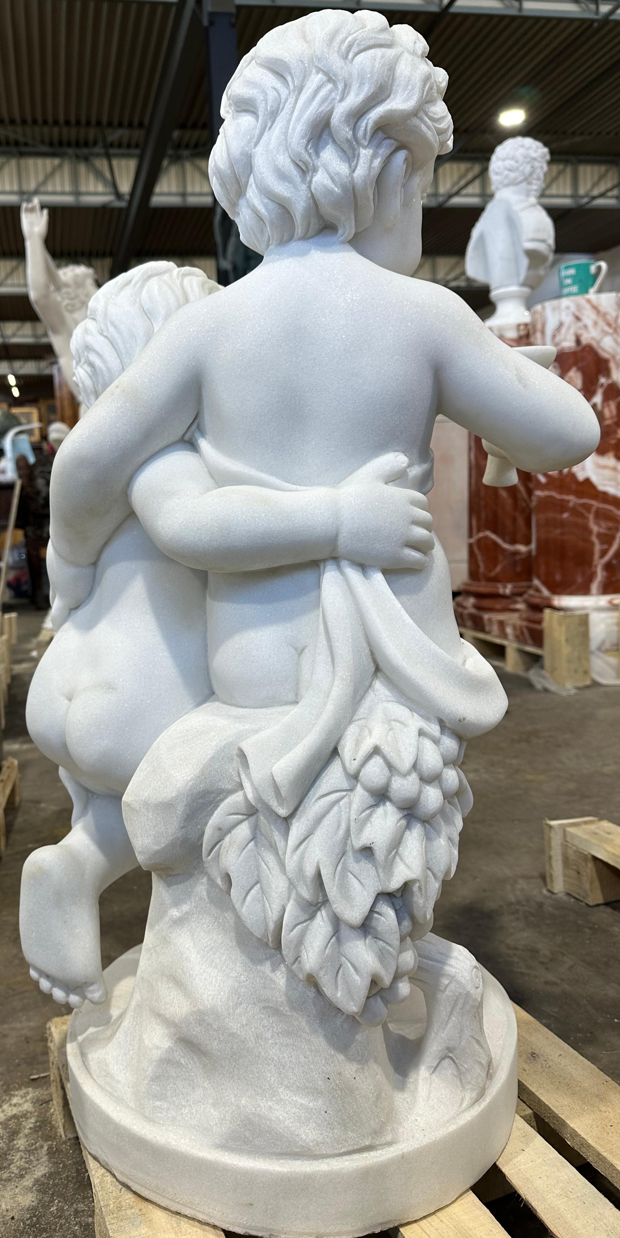 Hand-Carved Elegant Sculpture Of Two Putti In White Marble For Sale
