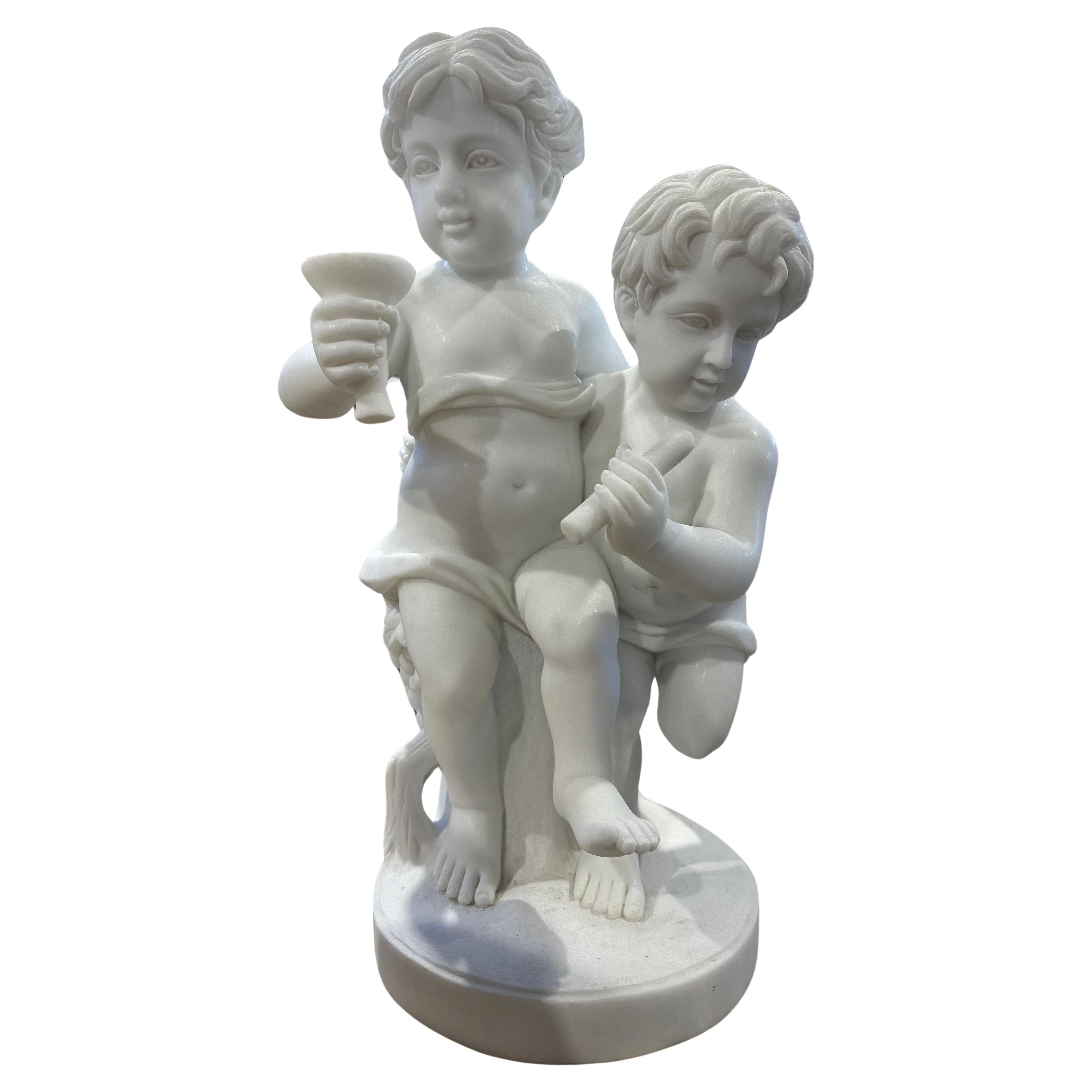Elegant Sculpture Of Two Putti In White Marble For Sale