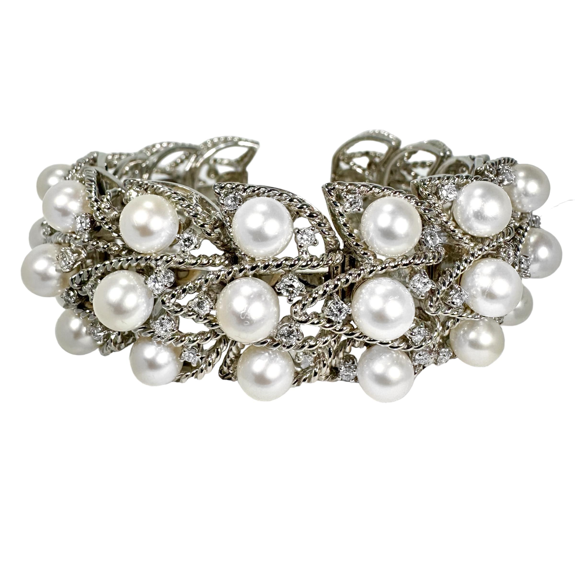 This lovely flexible, pearl and diamond cuff by Seaman Schepps is as elegant as it is comfortable to wear. The nature of the flexible links, with the open back design, allow for a range of wrist sizes to fit, from a medium to a large size. The