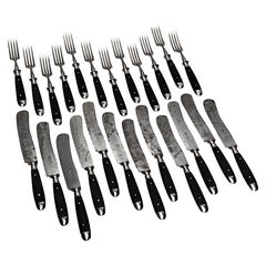 Elegantes Besteckset aus den 1930er Jahren für 12 Personen, aus Holz und Eisen.