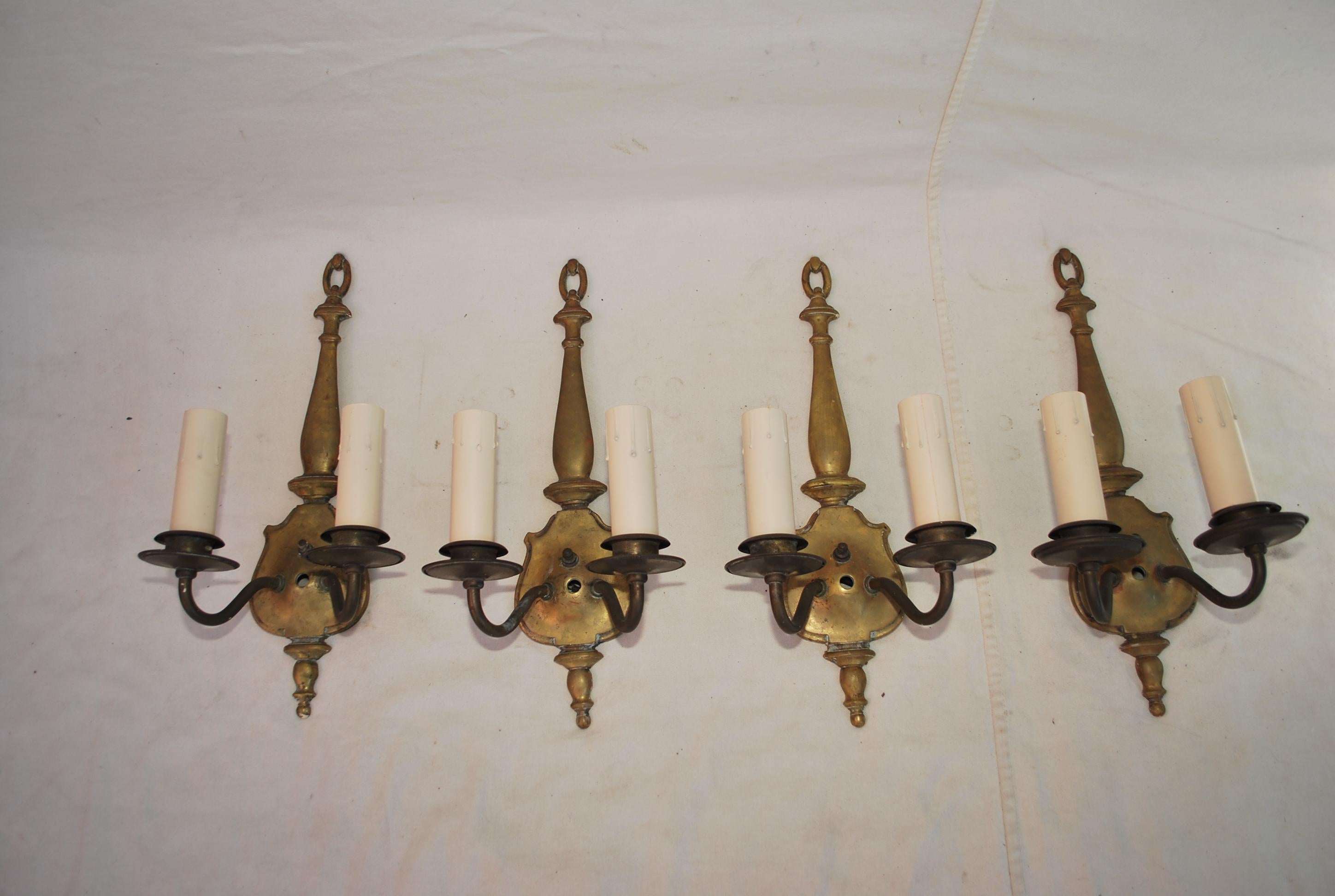 A very nice set of four 1920's brass sconces, the patina is much nicer in person.