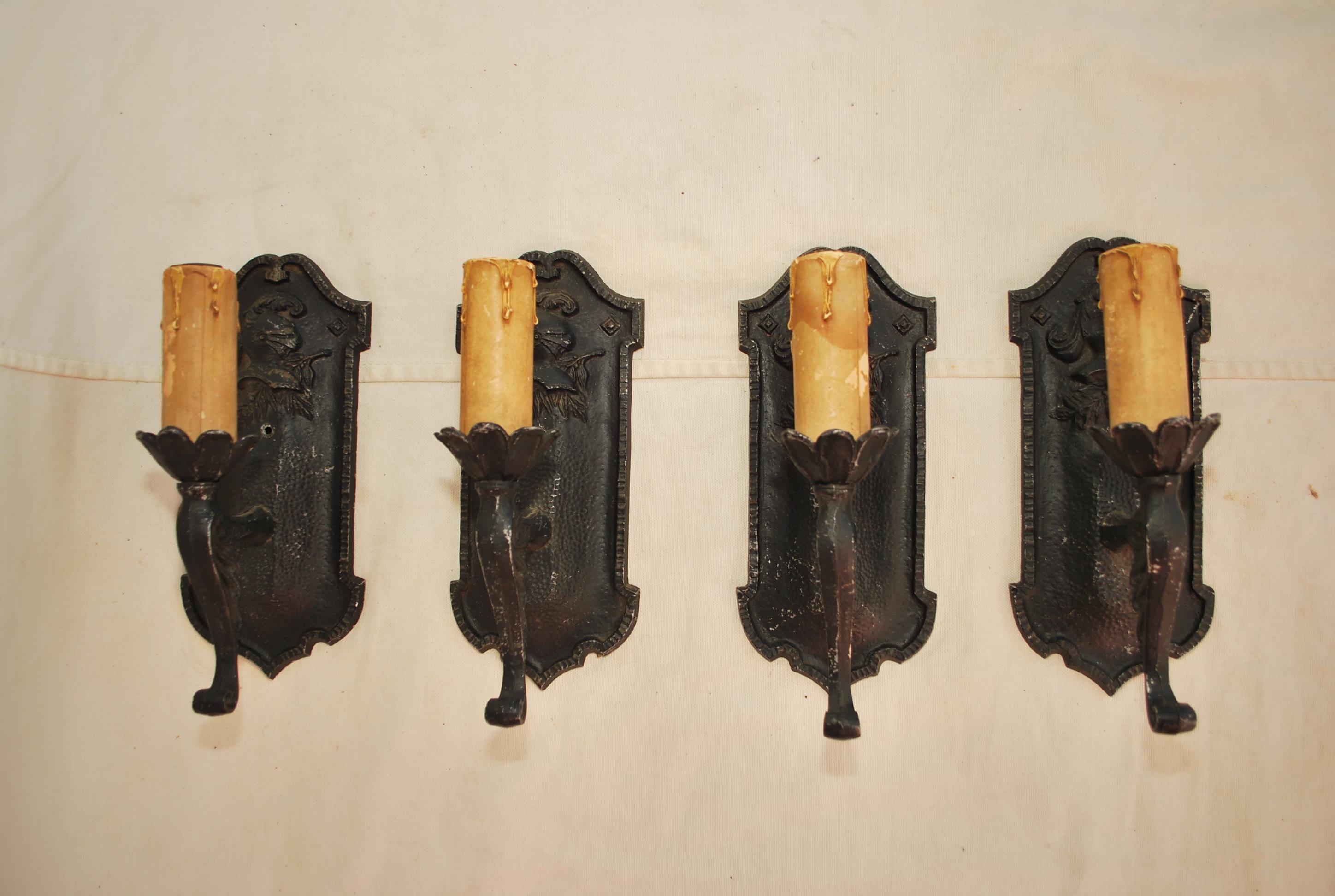 A beautiful set of four 1920's sconces, the patina is allot nicer in person, perfect for a Spanish or Tudor style.