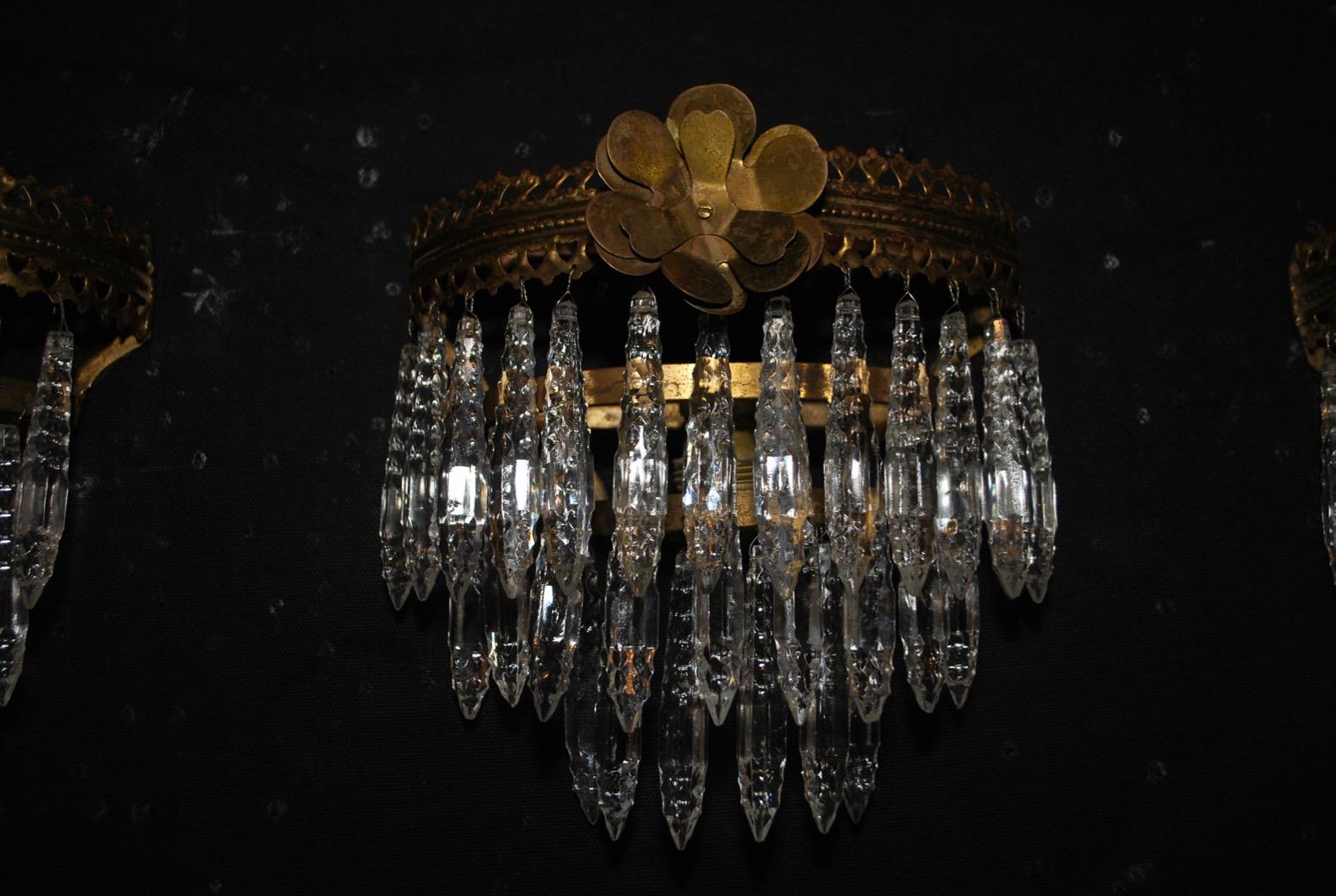 A beautiful set of four French brass and Crystal sconces, we could sell them by the pair, but the
price is for the set of four.

 
