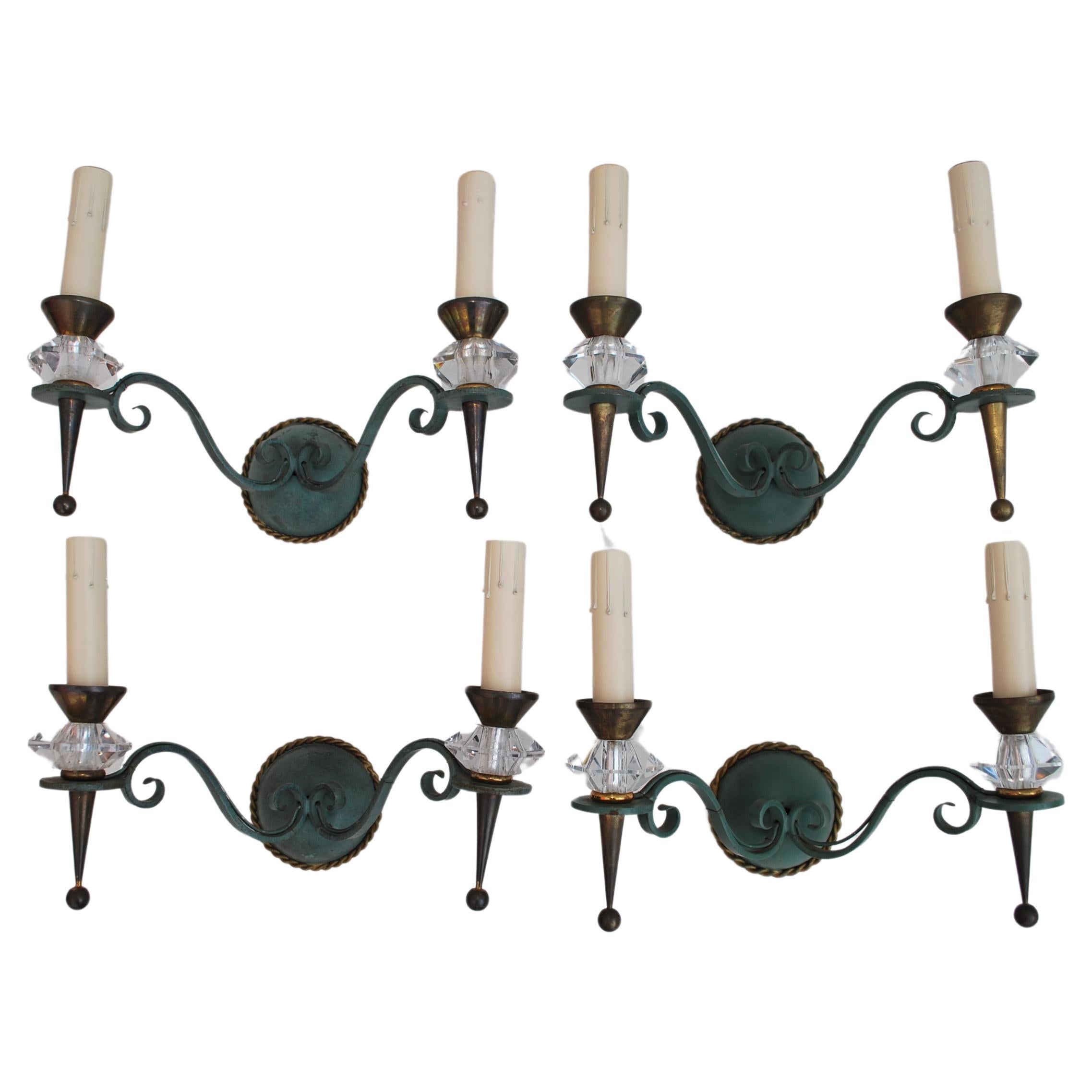 Elegant set of four iron/crytal sconces design by Jules Leleu