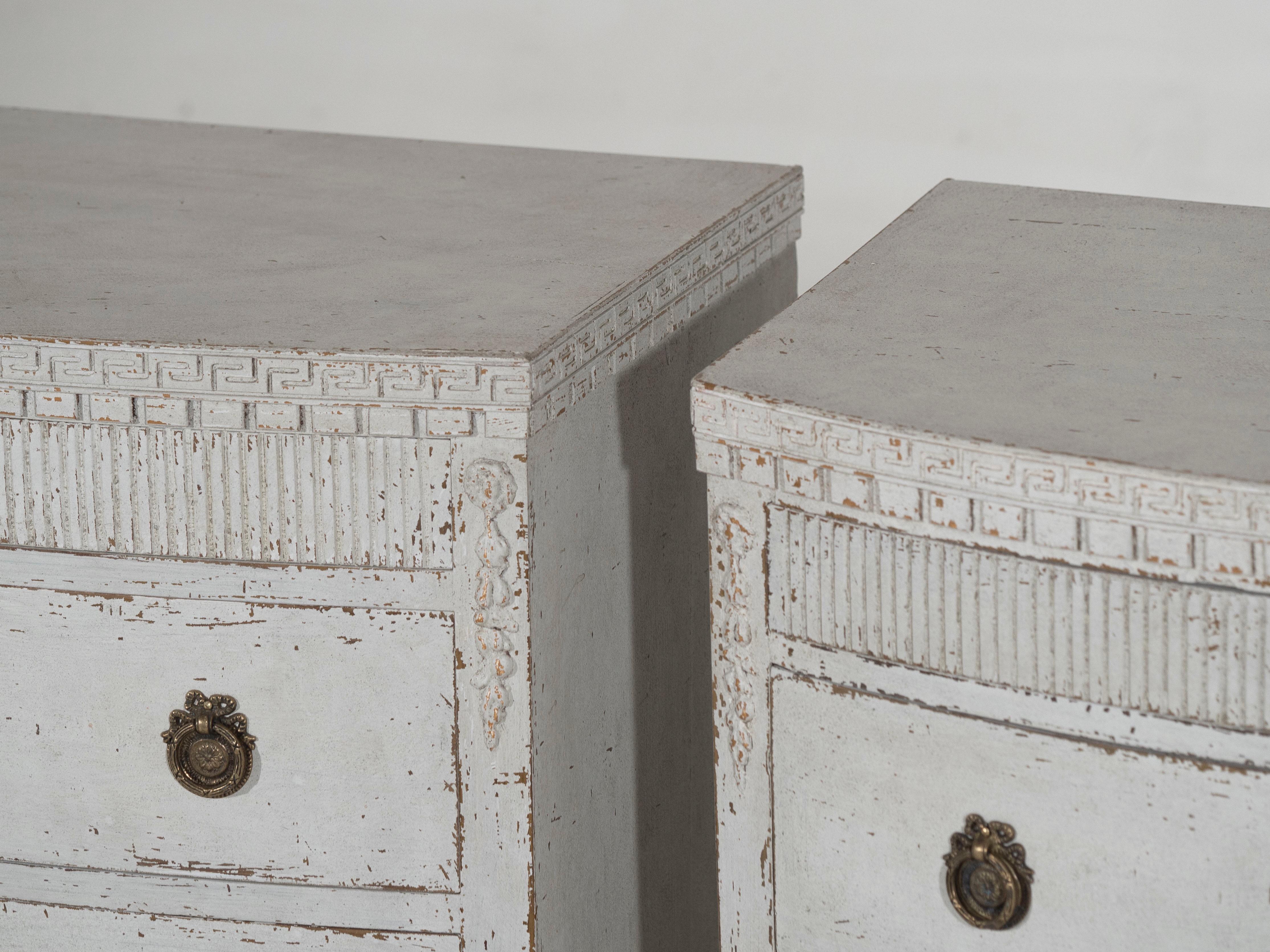 Elegant set of gustavian style chests featuring a gracefully curved front and carvings, circa 100 years old.