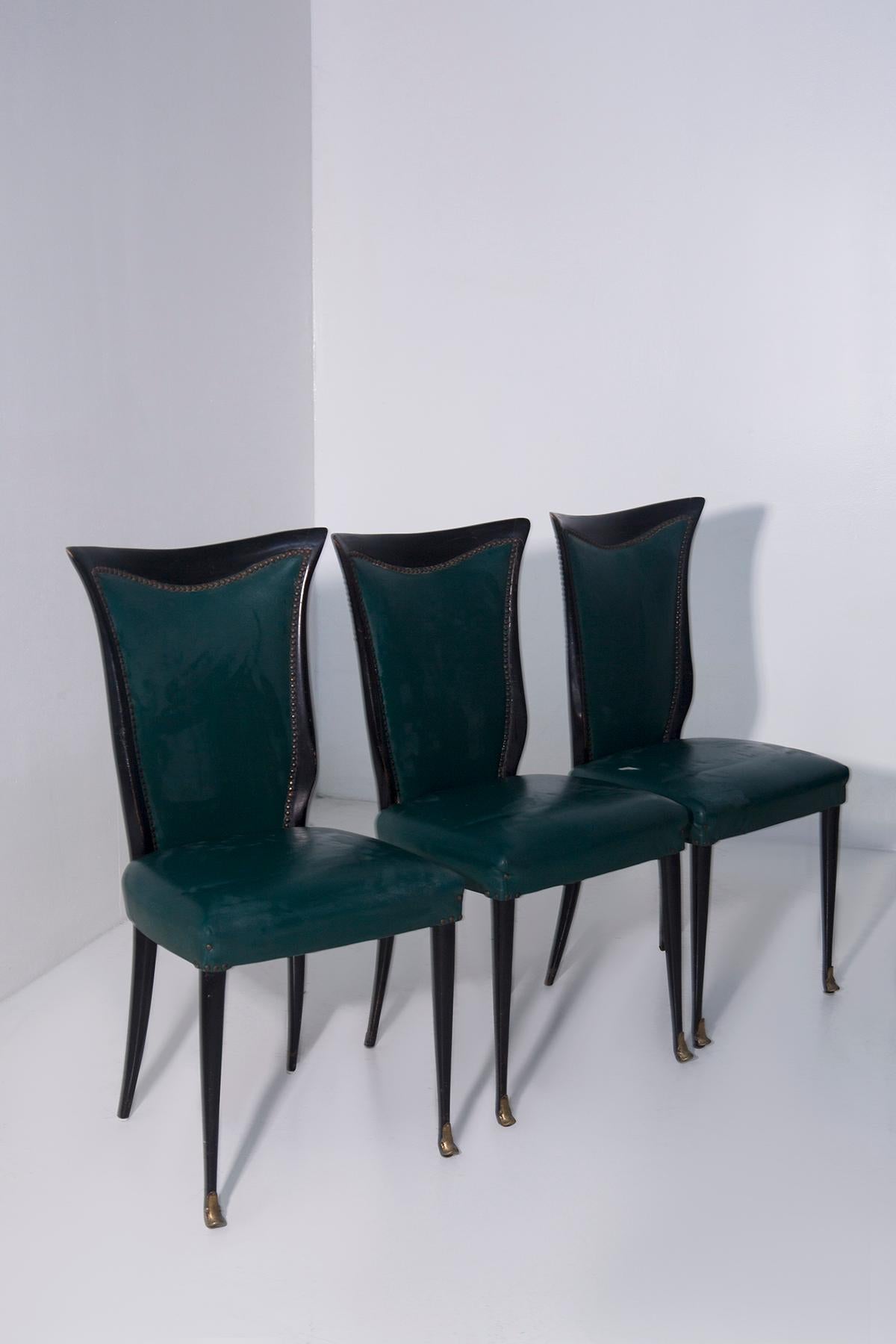 This extraordinary set of six vintage dining chairs, made in Italy in the 1950s, represents a rare example of postwar craftsmanship and sophisticated design. Every detail expresses a deep aesthetic sensibility and respect for the Italian