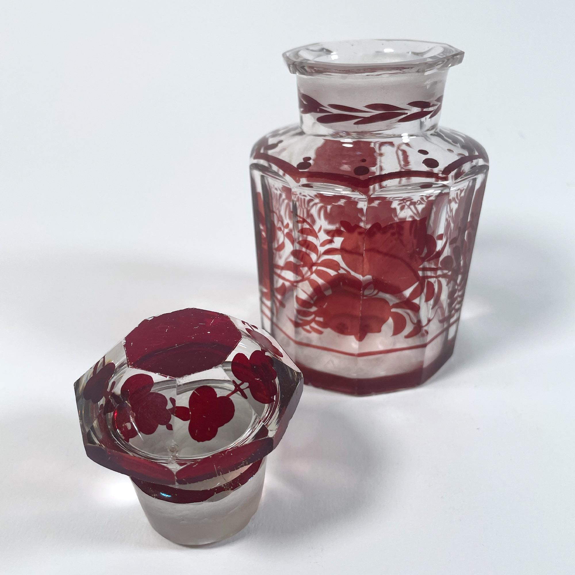 Crystal Elegant Set of Three 1940s Red Glass Bottles with Applied Relief Decoration For Sale