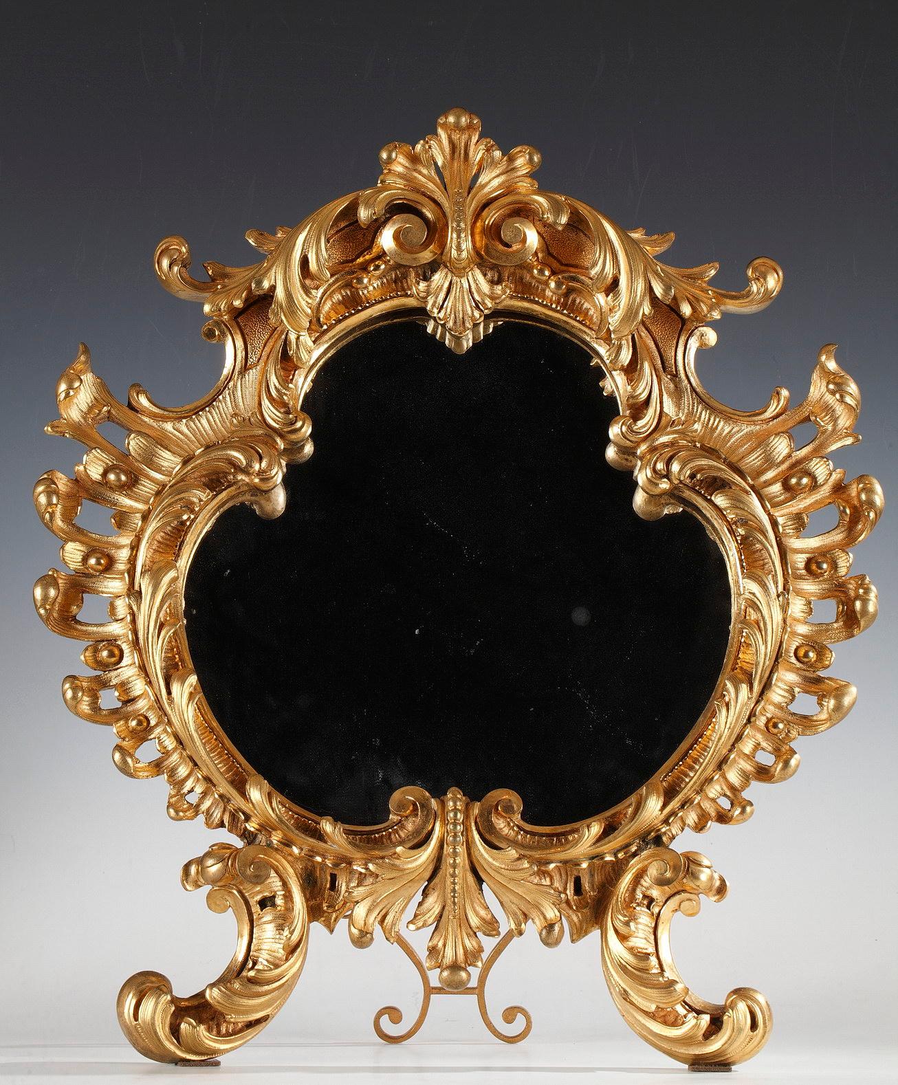 Main mirror: Height : 49 cm (19.3 in.) ; width : 43 cm (16.9 in.) ; depth : 6 cm (2.3 in.)
Small mirrors: Height : 40 cm (15.7 in.) ; width : 34 cm (13.4 in.) ; depth : 4 cm (1.6 in.)

Elegant set of three mirros, probably Venetian, in gilded bronze