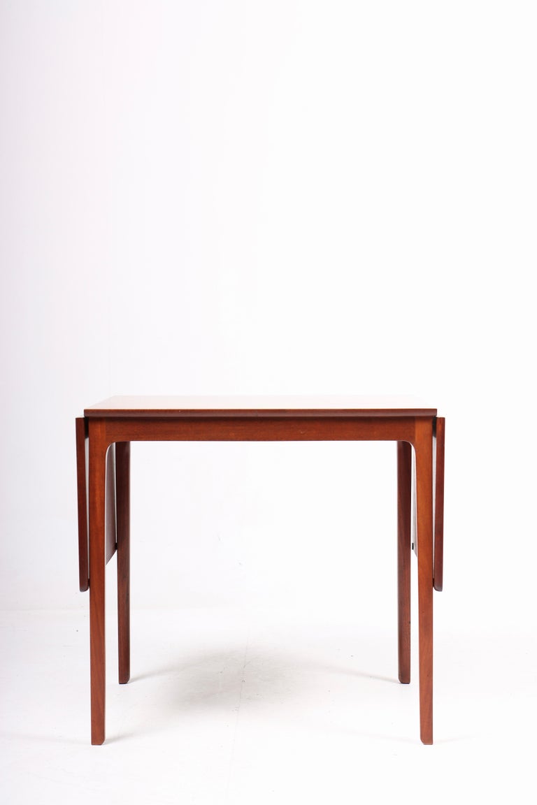 Side table in mahogany, designed by Ole Wanscher for cabinetmaker A.J. Iversen. Great original condition.

Measures: H.58 W.63/123 D.48 cm.