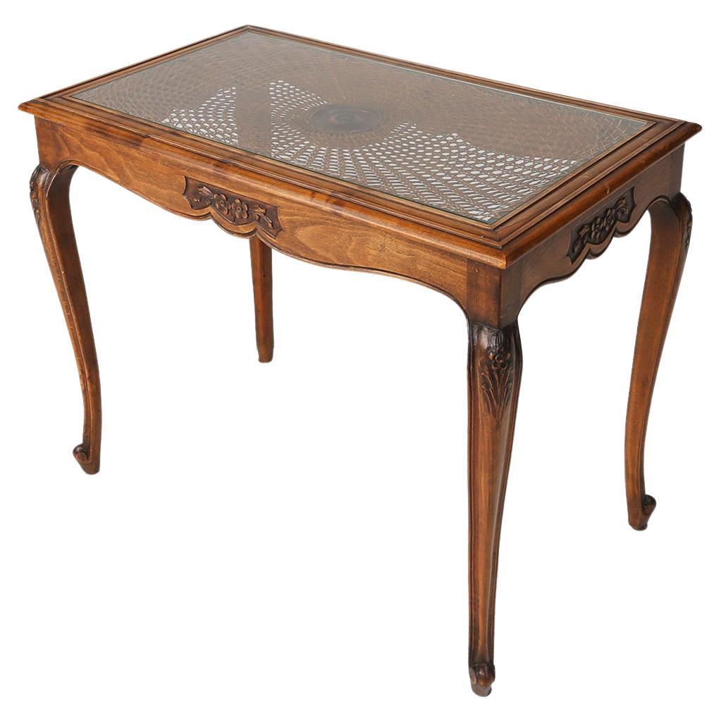 Elegant Side Table with Sculpted Elements and Rattan Top For Sale