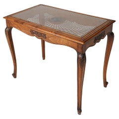 Elegant Side Table with Sculpted Elements and Rattan Top