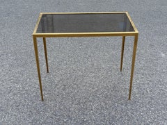 Elegant sidetable in brass with toned glass, from the 1960's