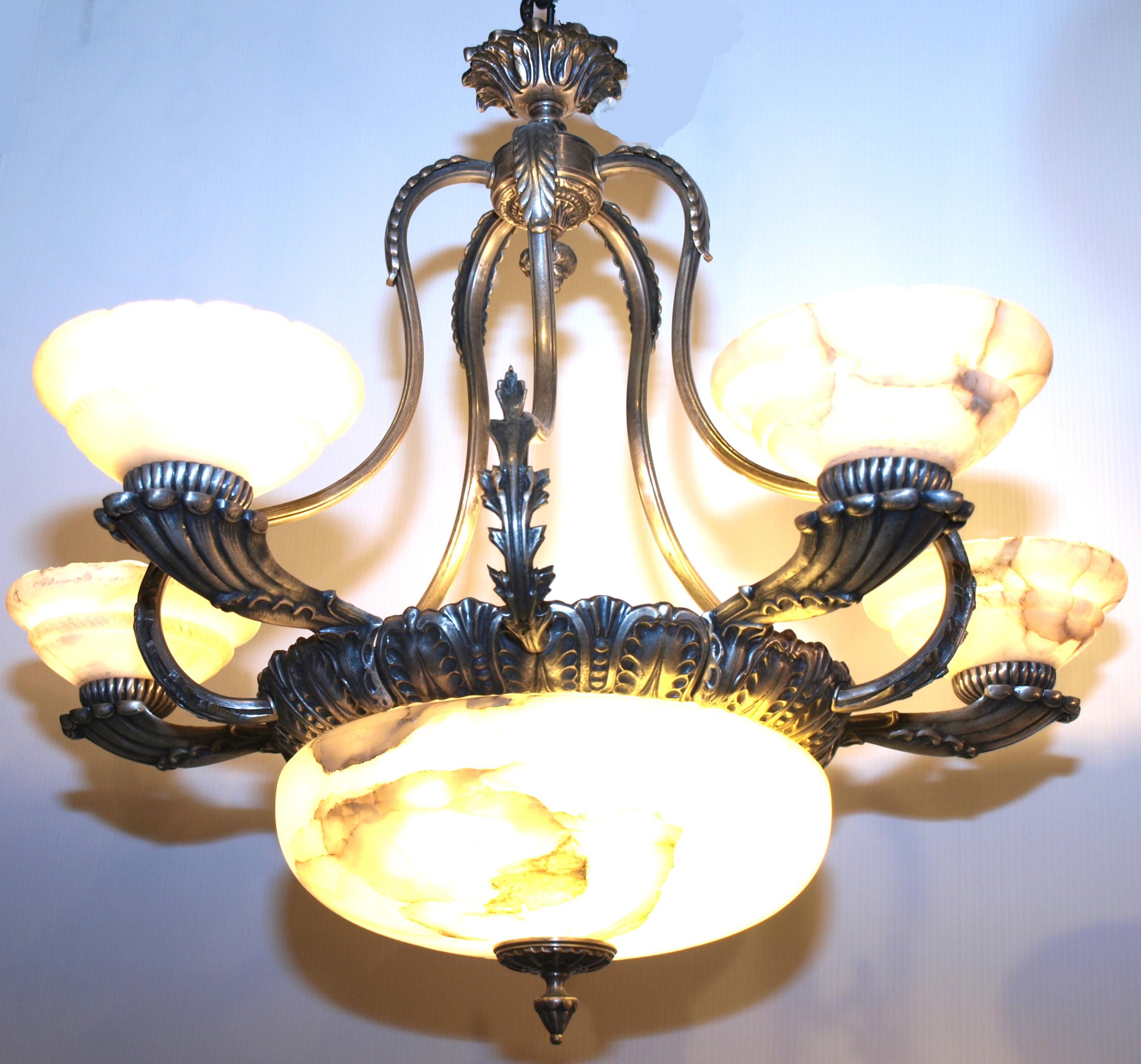 Elegant silver over bronze chandelier with alabaster bowl and shades.