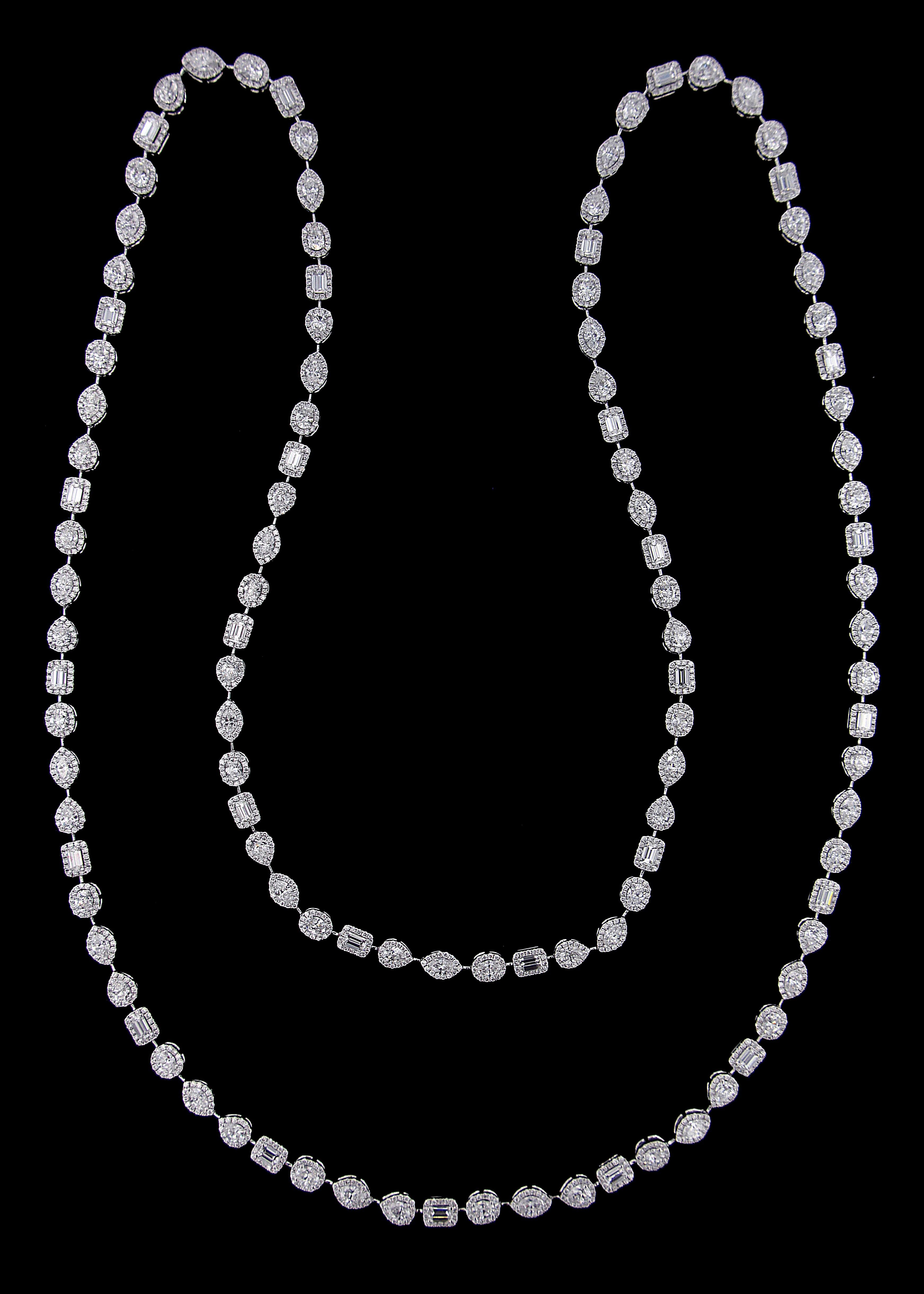 Elegant Single Line 18 Karat White Gold And Diamond Necklace.

Necklace:
Diamonds of approximately 28.158 carats, mounted on 18 karat white gold necklace. The Necklace weighs approximately around 41.148 grams.

Please note: The charges specified do