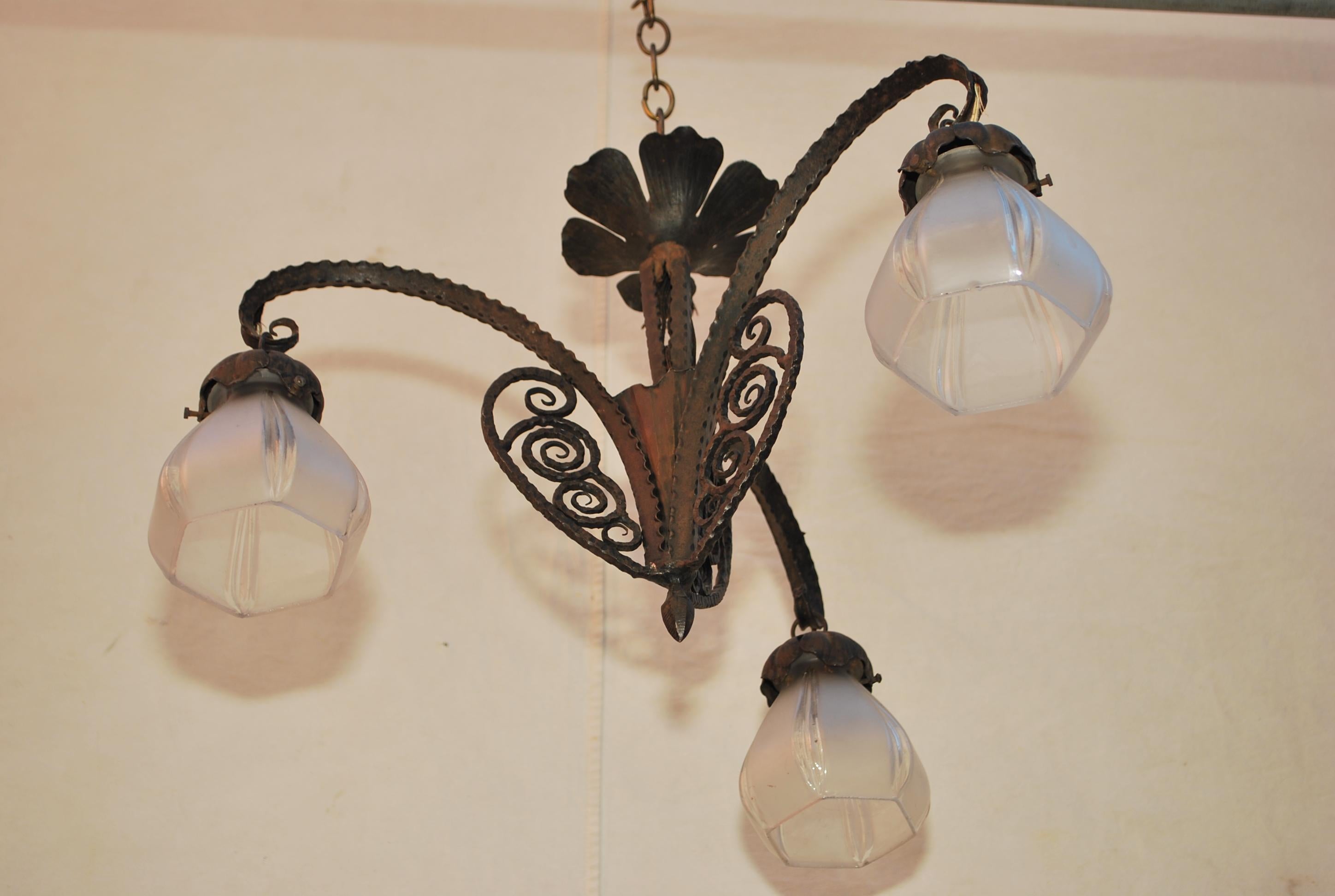 A beautiful French Art Deco wrought iron chandelier, the patina is so much nicer in person