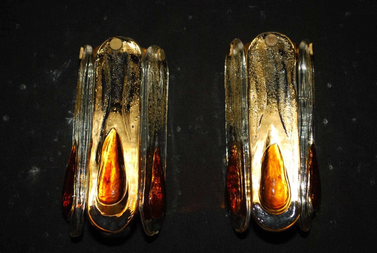 A beautiful small pair of Murano sconces, by Mazzega, the texture of the glass is so much more beautiful in person.

 