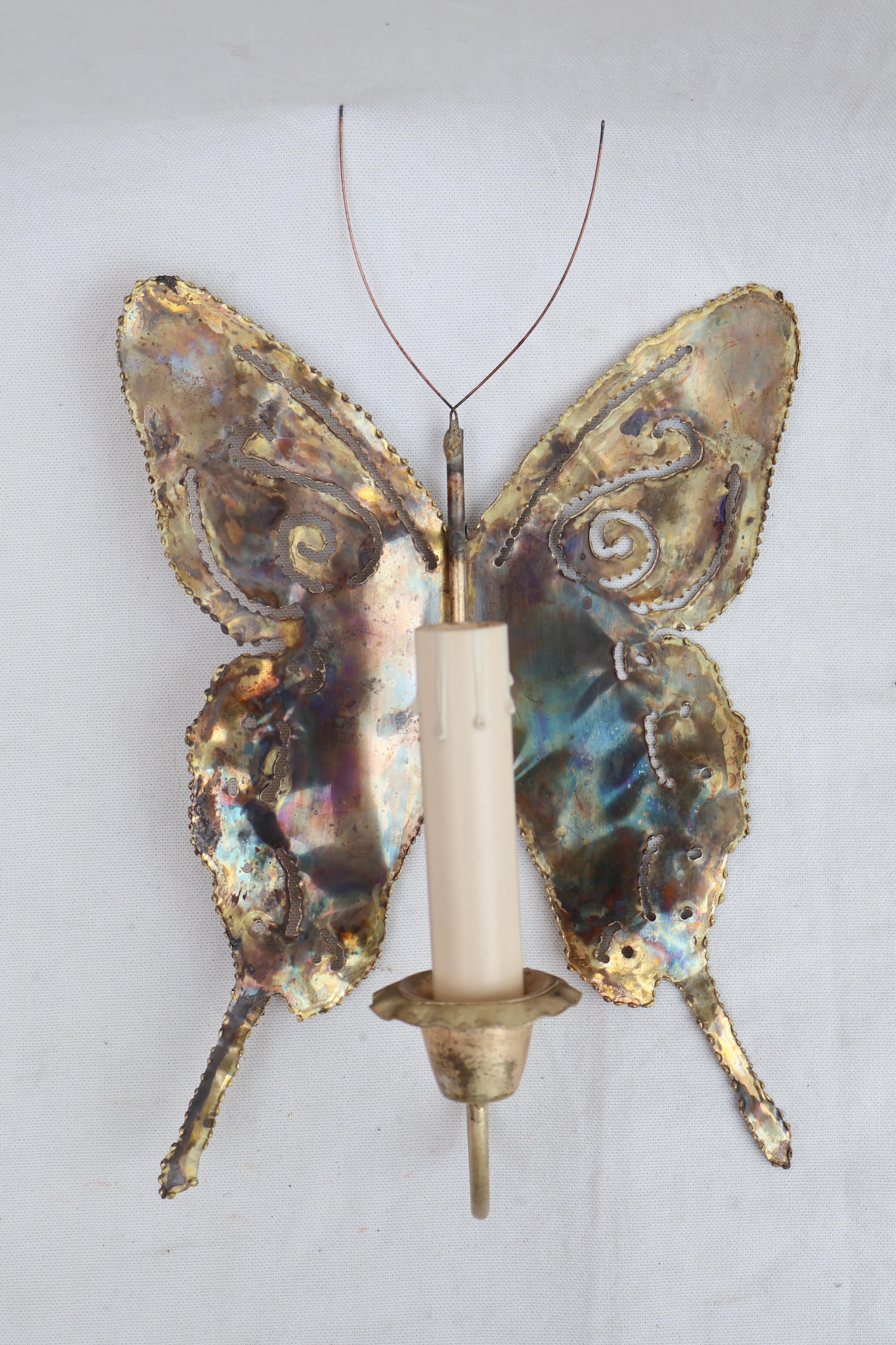 A cute small pair of 1970's butterfly brass sconces, in the brutalist style, they are thin and delicate