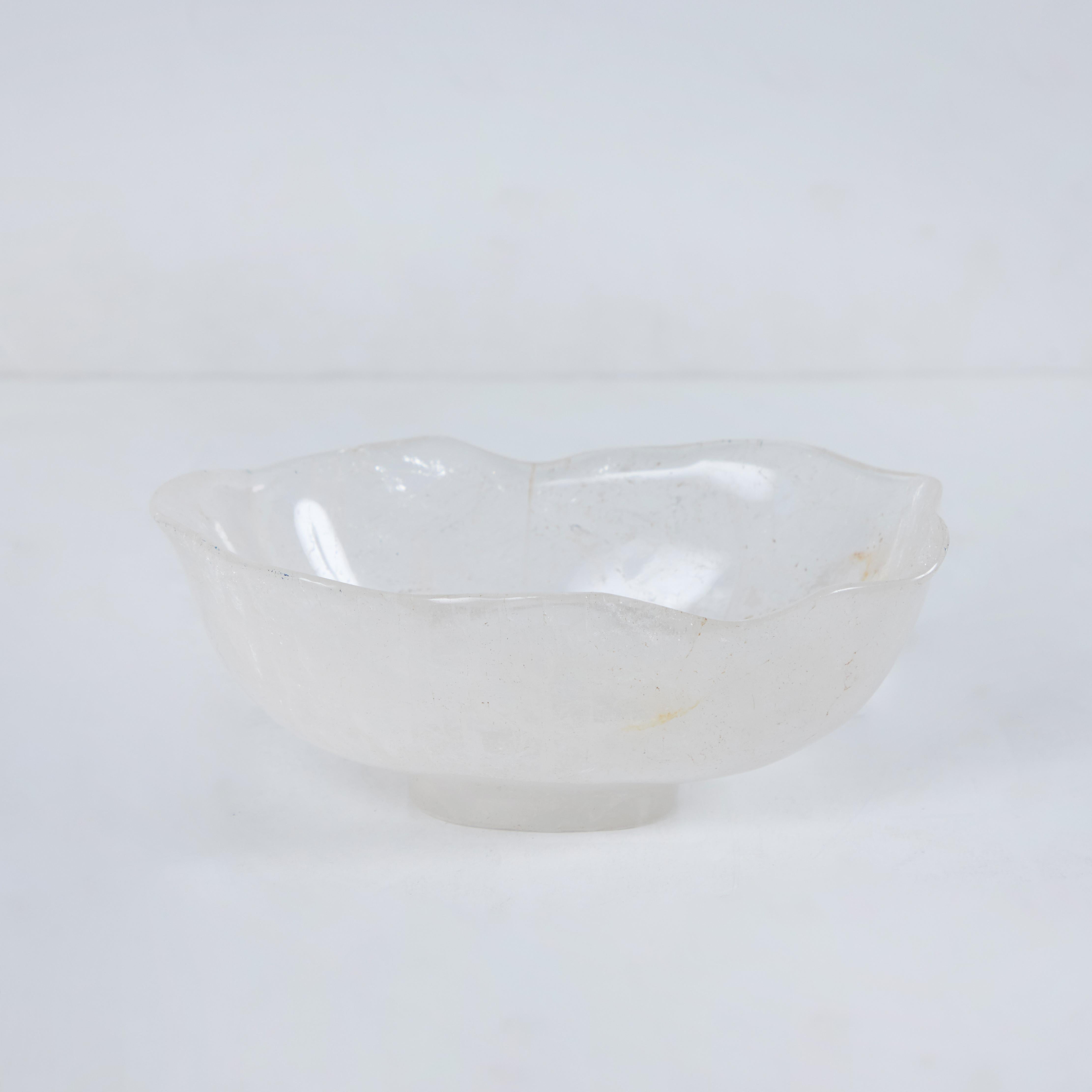 An elegant, scalloped edge, footed, small rock crystal bowl.
