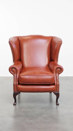 Elegante sillón Chesterfield orejero de cuero vacuno inglés liso