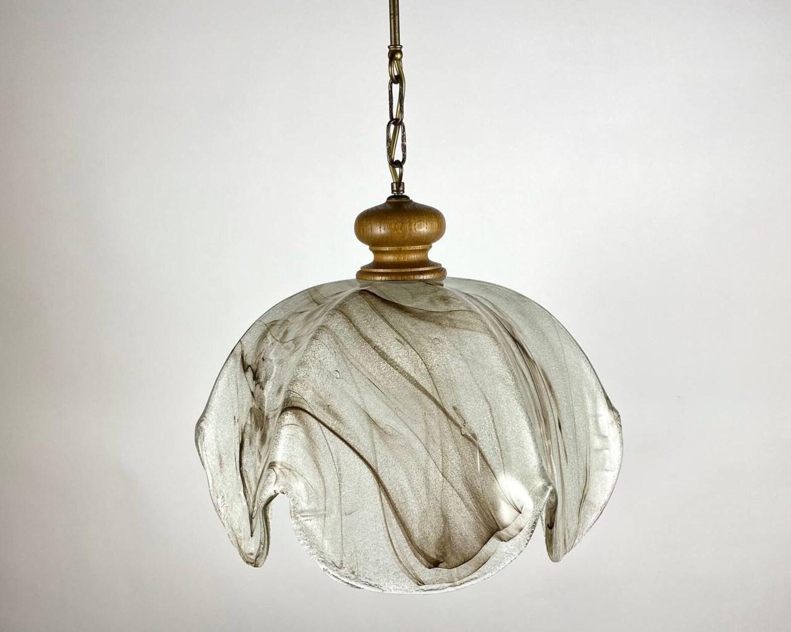 Beautiful vintage hanging lamp with textured glass lampshade! 

 Hanging lamp with original glass shade, decorated with an abstract pattern that gives a nice light. 

 Emits diffuse light upwards and bright light downwards.

 Roof cup in wood and