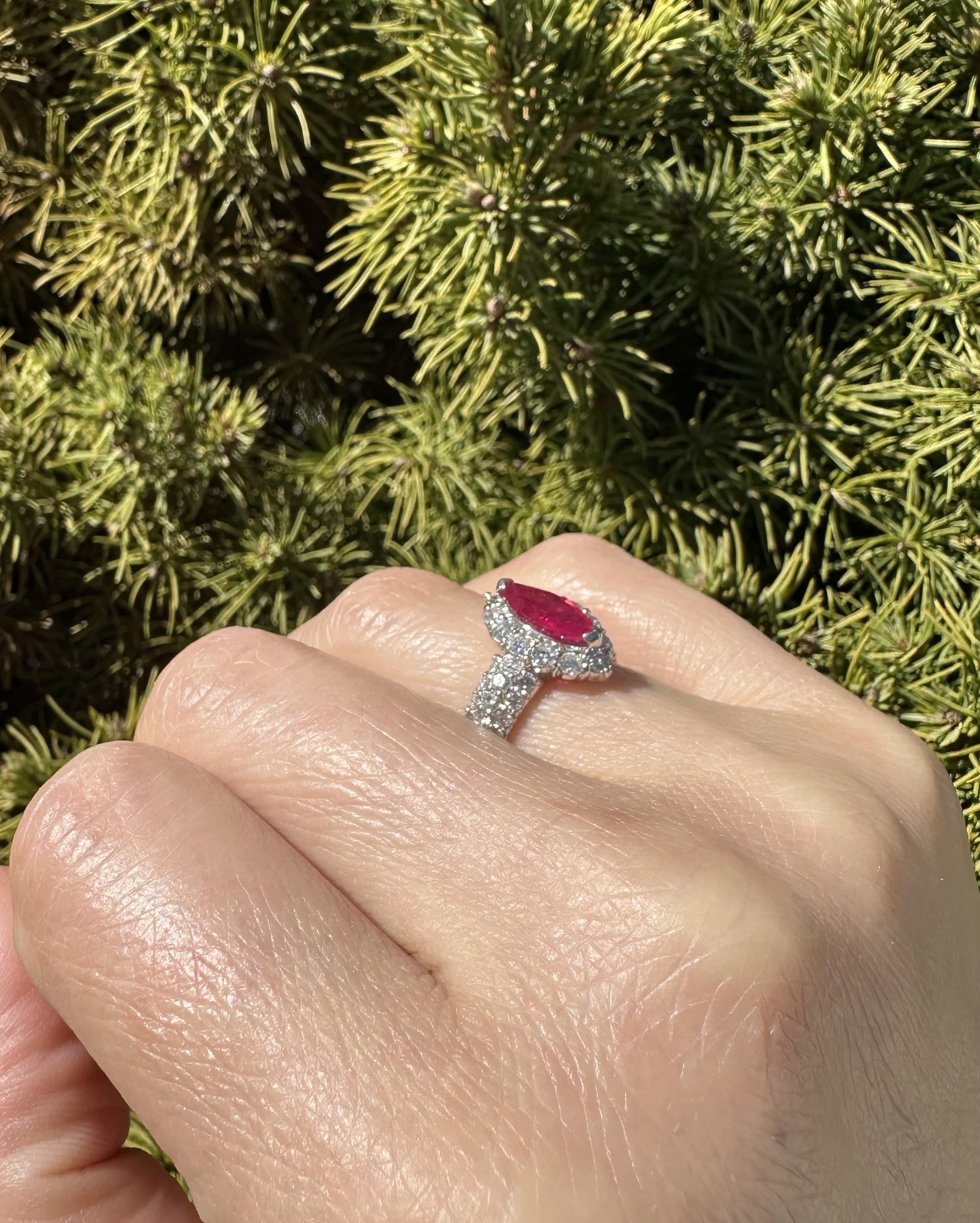 --Stone(s):--
(1) Natural Genuine Ruby - Marquise Cut - Prong Set - Nice Sharp Rich Red Color - Burma - Heated - 1.06ct (exact stamped)
** See Certification Details Below for Complete Info **
(50) Natural Genuine Diamonds - Round Brilliant Cut -