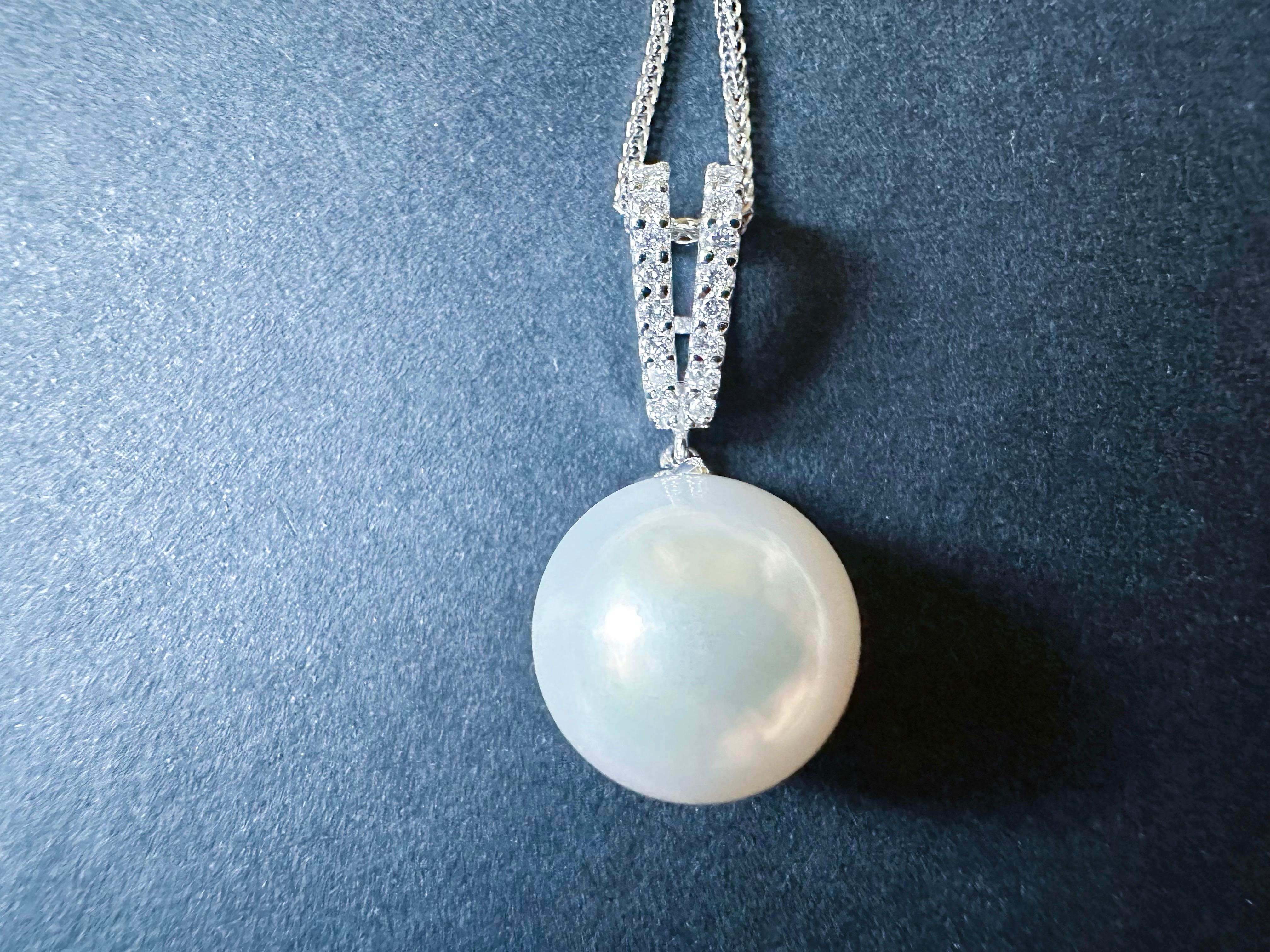 Discover the elegance of our handmade South Sea pearl pendant, expertly crafted in 18K white gold with stunning diamond accents. This timeless piece features a simple yet classic design that ensures it will last a lifetime.

Each South Sea pearl is