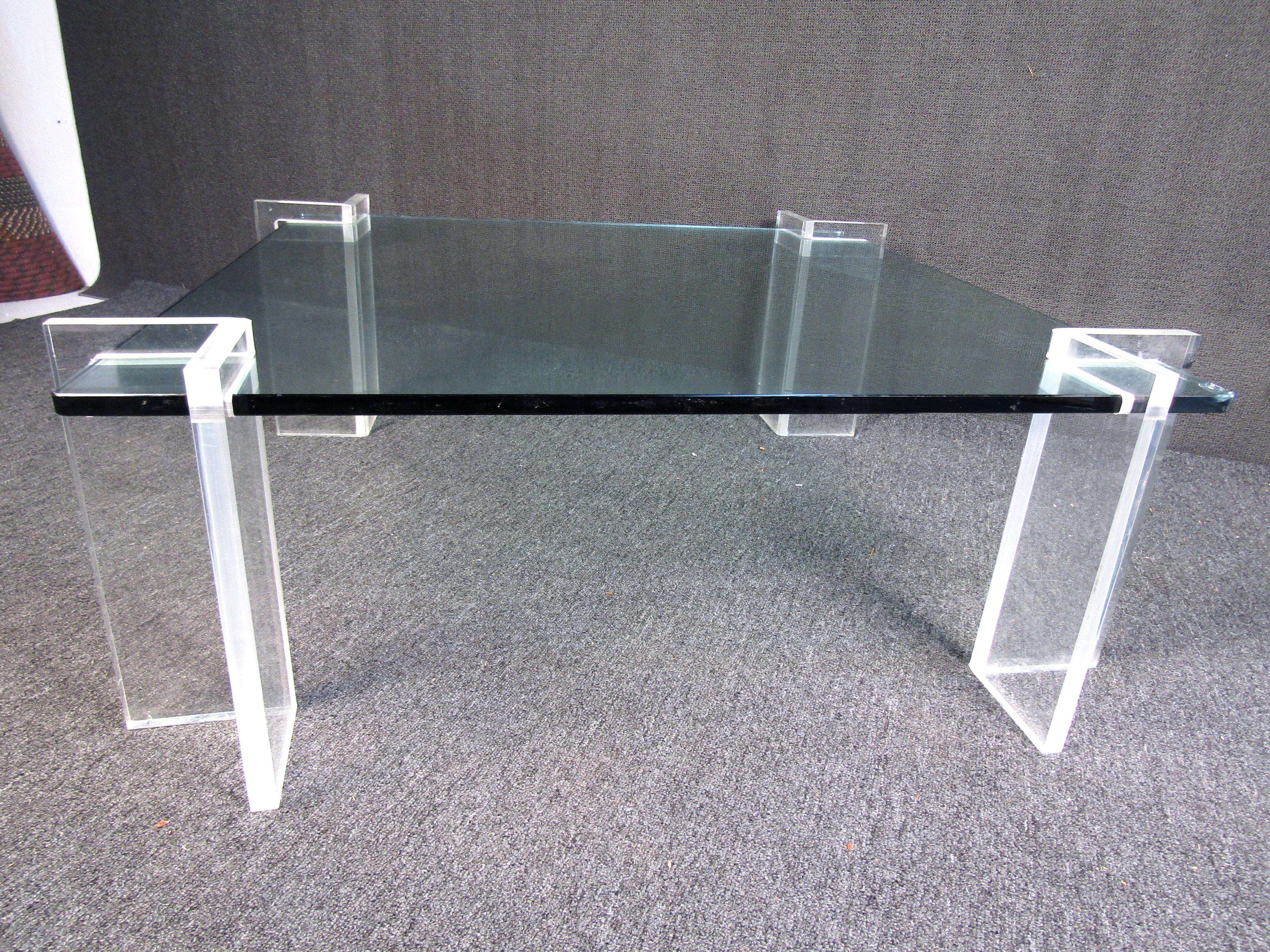 Lucite and glass complement each other strikingly in this eye-catching Mid-Century Modern coffee table. Please confirm item location with seller (NY/NJ).