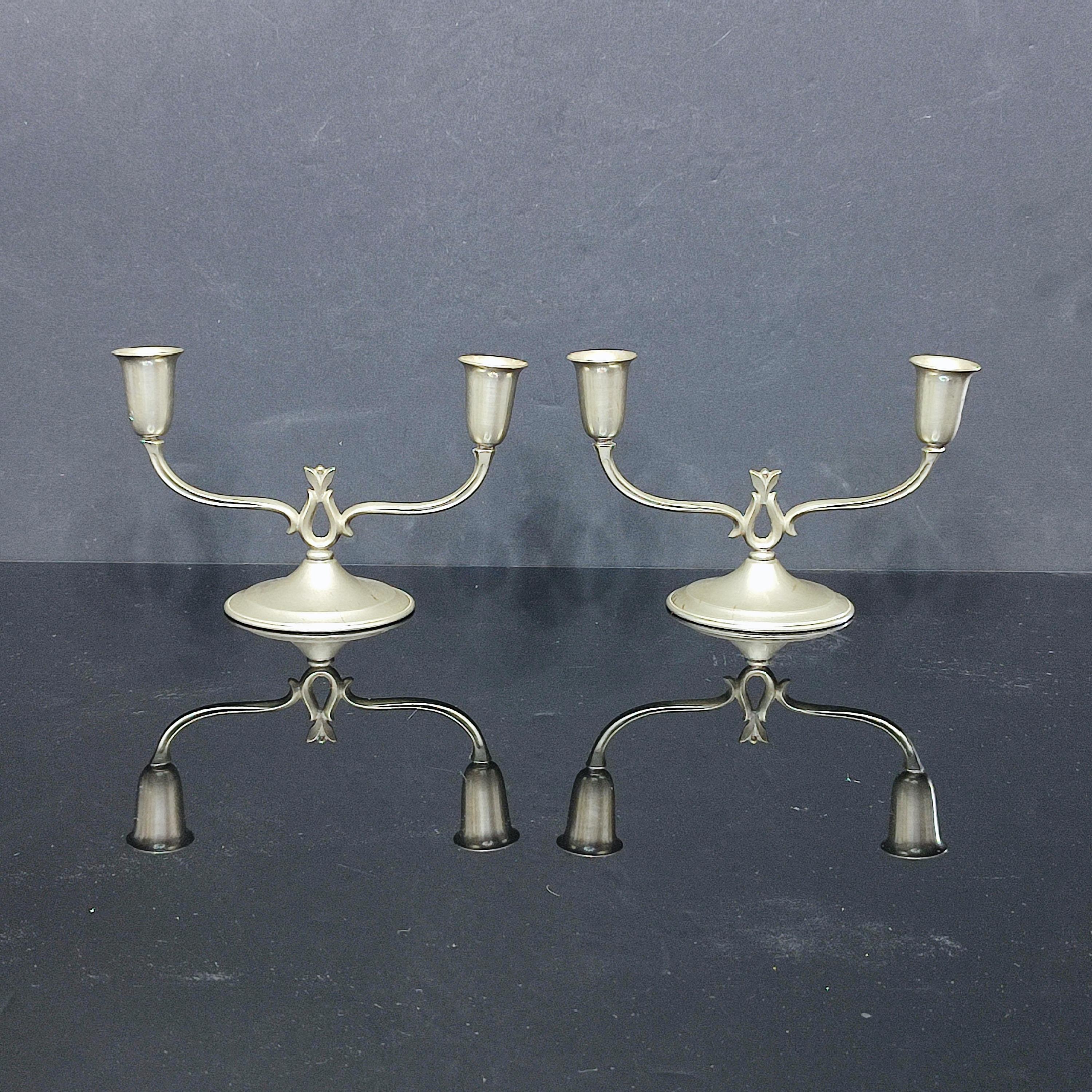 Pair of Pewter Candlesticks by Svenskt Tenn – Swedish Grace Design, Sweden 1933
Svenskt Tenn is the iconic Swedish design house known for its timeless craftsmanship and refined aesthetic. These twin-arm candelabras embody the clean lines and