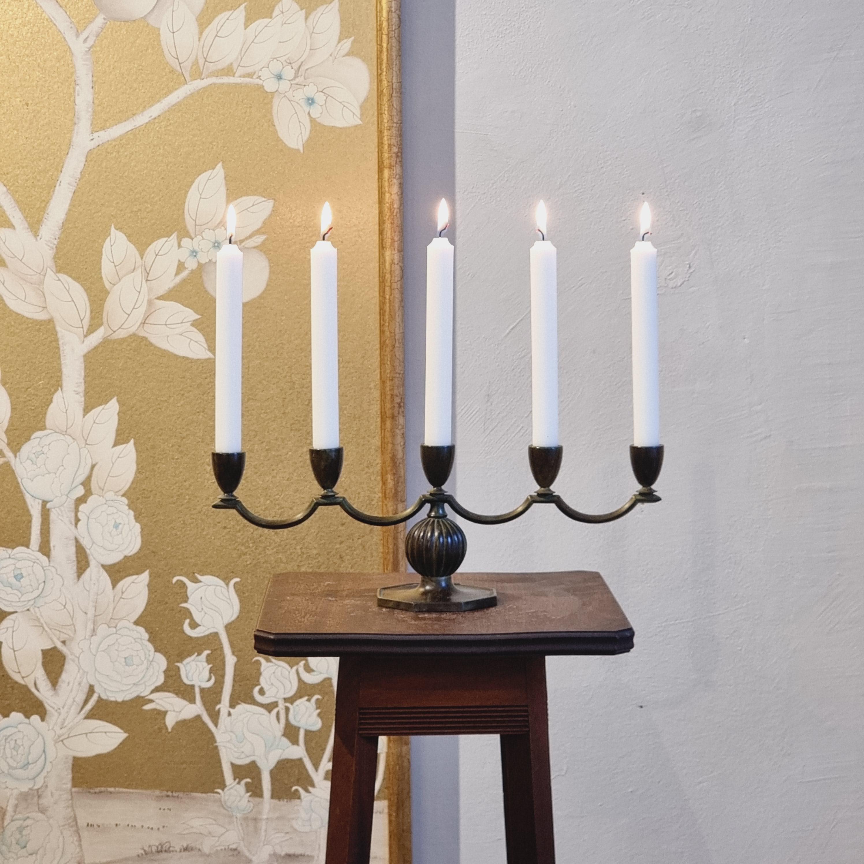 A decorative, solid bronze candelabra with  by Jacob Ängman for GAB / Guldaktiebolaget. With antique patina finish. Sweden, 1920/30s - Art Deco / Swedish Grace. In beautiful condition, smaller signs of age and wear. 

Marked: GAB Brons, 91
