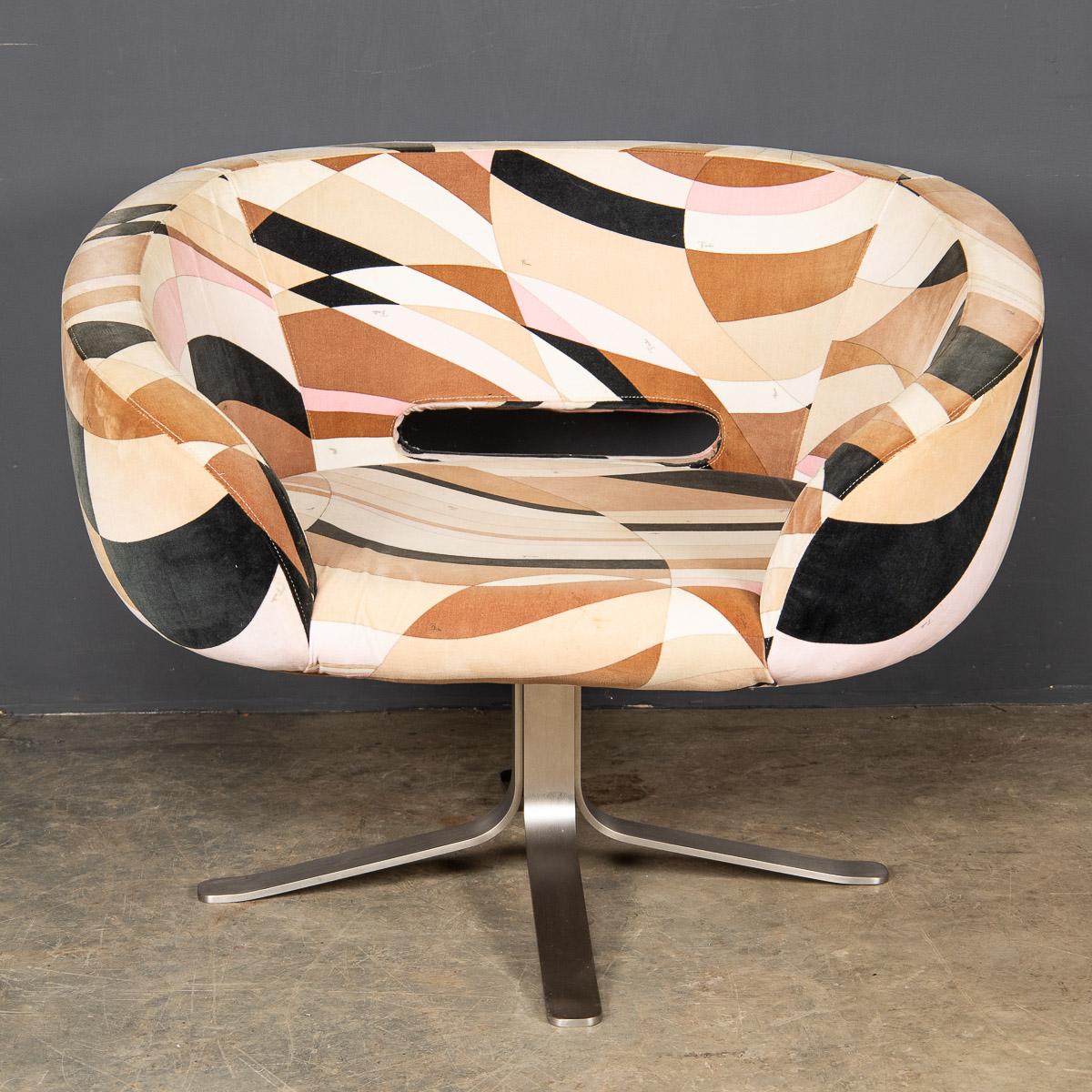 An over sized swivel chair with brushed steel legs and plush pucci velvet upholstery. This chair is a collaboration between Patrick Norguet, French furniture designer, Emilio Pucci, Italian fabric designer and Giulio Cappellini producer of such