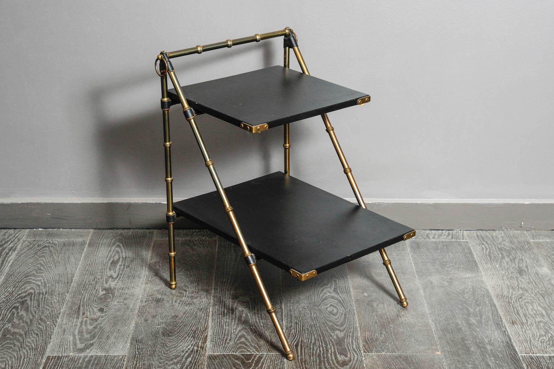 Fine telephone table by Adnet with leather and simulated leather in original condition.
Bamboo brass style,
circa 1960.
By Jansen, Similar model in 
