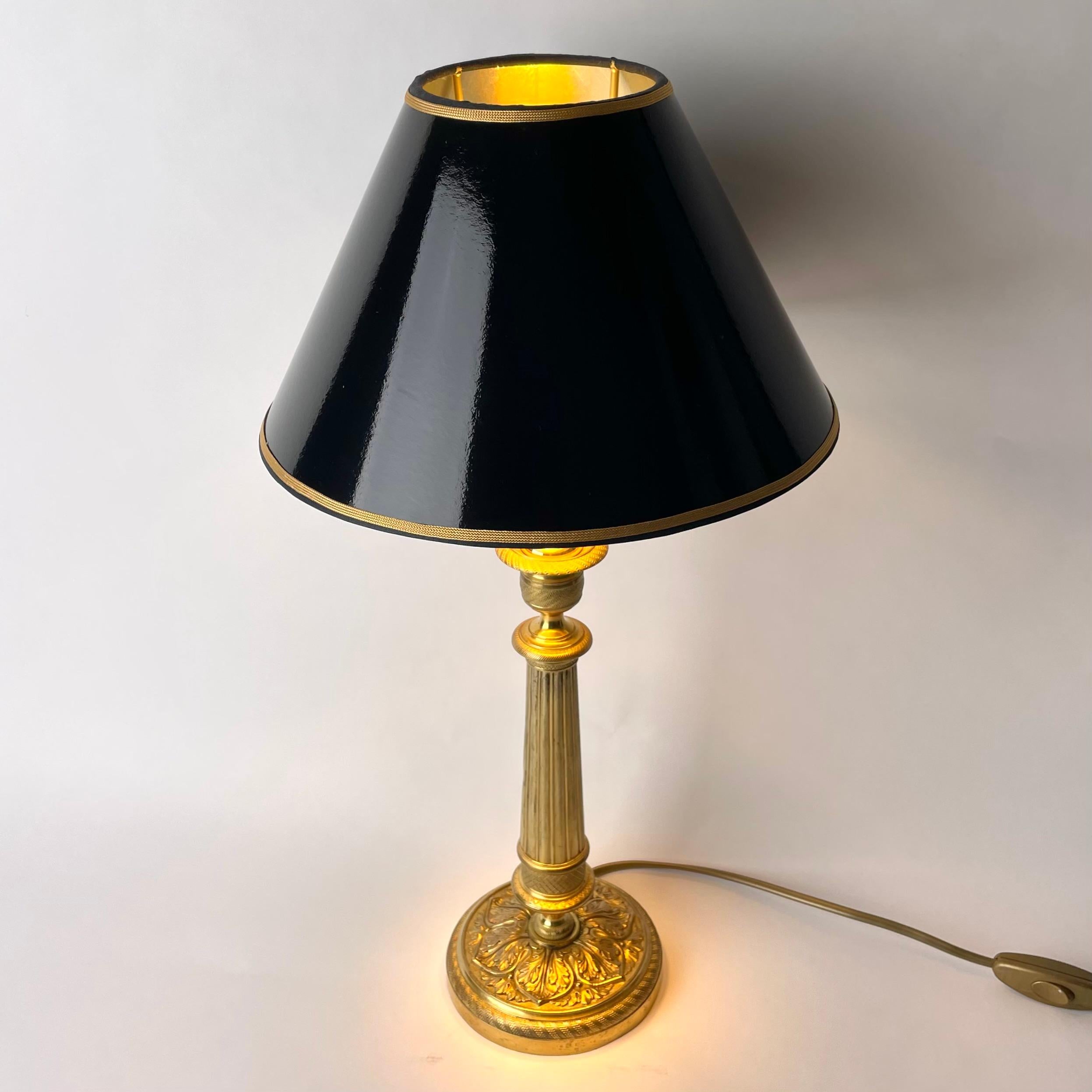 French Elegant Table Lamp in bronze. Originally an Empire candlestick from the 1820s For Sale